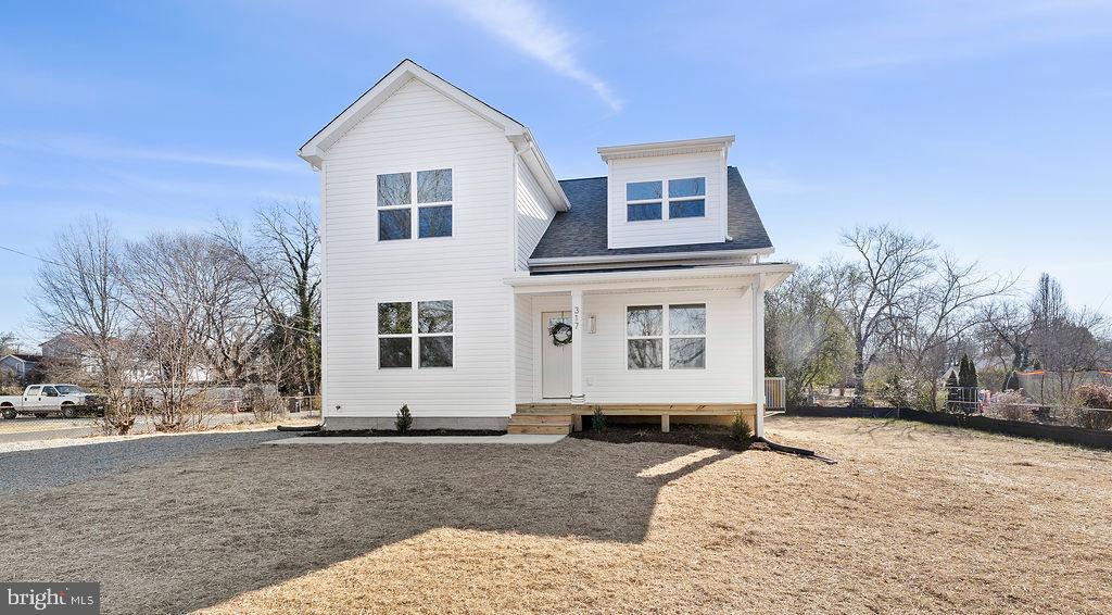 Completed new construction – The Dogwood by Ironwood Homes, set on 0.36 acres in the heart of downtown Gordonsville! This modern interpretation of country chic blends timeless charm with thoughtful design, creating the perfect space for a growing family. The open-concept layout features a dramatic two-story living room filled with natural light, a farmhouse sink, and custom   details. The main-level primary suite offers a spa-like retreat with a free-standing tub and designer tile work. Upstairs are three additional bedrooms, while the gourmet kitchen boasts quartz countertops,stainless steel appliances, and luxury vinyl plank flooring throughout. Brand new community pool close by! grass is virtually placed