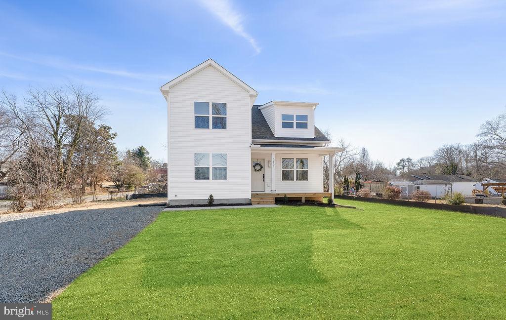 Completed new construction – The Dogwood by Ironwood Homes, set on 0.36 acres in the heart of downtown Gordonsville! This modern interpretation of country chic blends timeless charm with thoughtful design, creating the perfect space for a growing family. The open-concept layout features a dramatic two-story living room filled with natural light, a farmhouse sink, and custom   details. The main-level primary suite offers a spa-like retreat with a free-standing tub and designer tile work. Upstairs are three additional bedrooms, while the gourmet kitchen boasts quartz countertops,stainless steel appliances, and luxury vinyl plank flooring throughout. Brand new community pool close by! grass is virtually placed