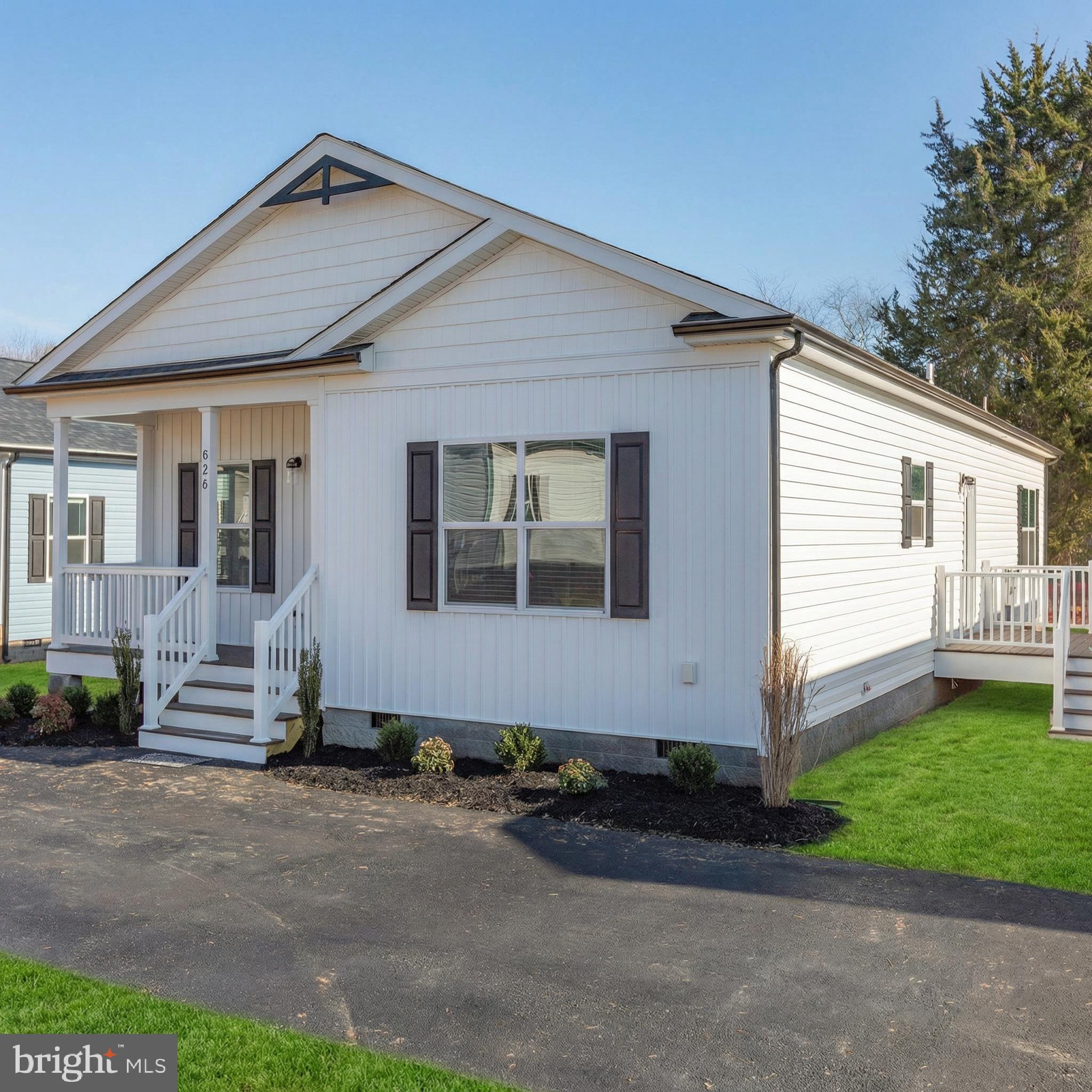 COMPLETE & MOVE-IN READY! New 3BR/2BA home with over 1,700 sq. ft. in the heart of town. Modern finishes throughout including 9’ ceilings, crown molding, black fixtures, recessed lighting, oversized ceiling fan, and shiplap accents. Open kitchen features quartz countertops, tile backsplash, stainless steel appliances, and a large island with ample cabinet space. Dining room includes sliding glass door leading to a 12x14 rear deck with vinyl rails.

Primary suite offers a walk-in closet, dual vanities, and custom tile shower. Exterior features a 6’x15’ covered front porch with stacked stone, black gutters/pediments, professional landscaping, and paved parking. Connected to public water/sewer and Xfinity Internet.

Convenient location—15 mins to Lake Anna, 40 mins to Short Pump, and 45 mins to Charlottesville. Walk to local park and baseball field. High school with track is 1.7 miles away. Bark Park dog park just 2 miles away.

Located in a top-rated school district—recognized as one of 2023 Best School Districts in America. Seller will pay for first year of lawn maintenance. Other lots and floor plans available.
