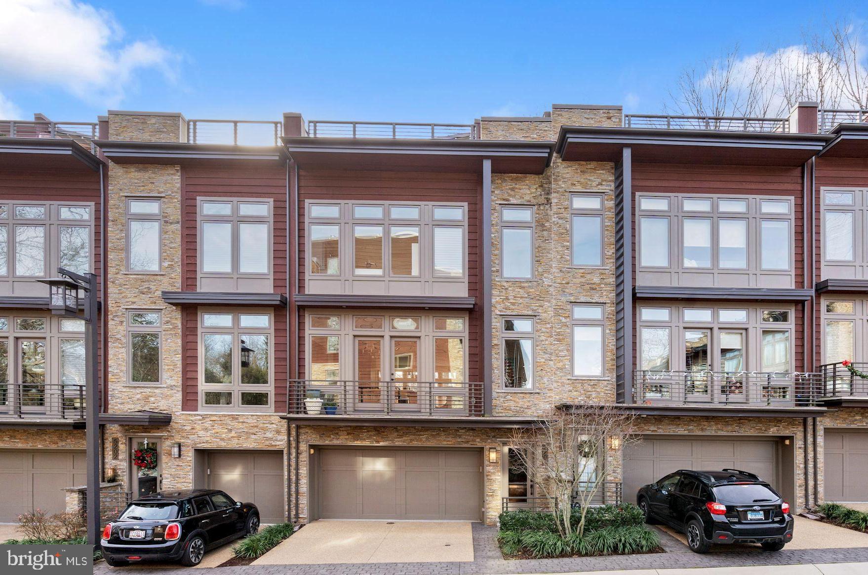 This move-in ready residence at Little Falls Place is an urban oasis - a luxurious townhome backing to wooded surroundings and located in close proximity to both downtown Bethesda and just one stoplight to DC. Built in 2015, this like-new townhouse features three bedrooms, two full baths, two powder rooms and a bonus room - office/gym/rec room...you decide!  The residence invites nature in through floor-to-ceiling windows, as wells as a fenced rear patio with mature landscaping and a roofdeck offering spectacular views of lush green parkland. Features include an elevator to all levels including the roofdeck, 9ft ceilings, hardwood flooring, a gourmet kitchen, spa baths, built-ins and walk-in closets, two gas fireplaces, a two-car garage, an alarm system, and an expanded laundry area.