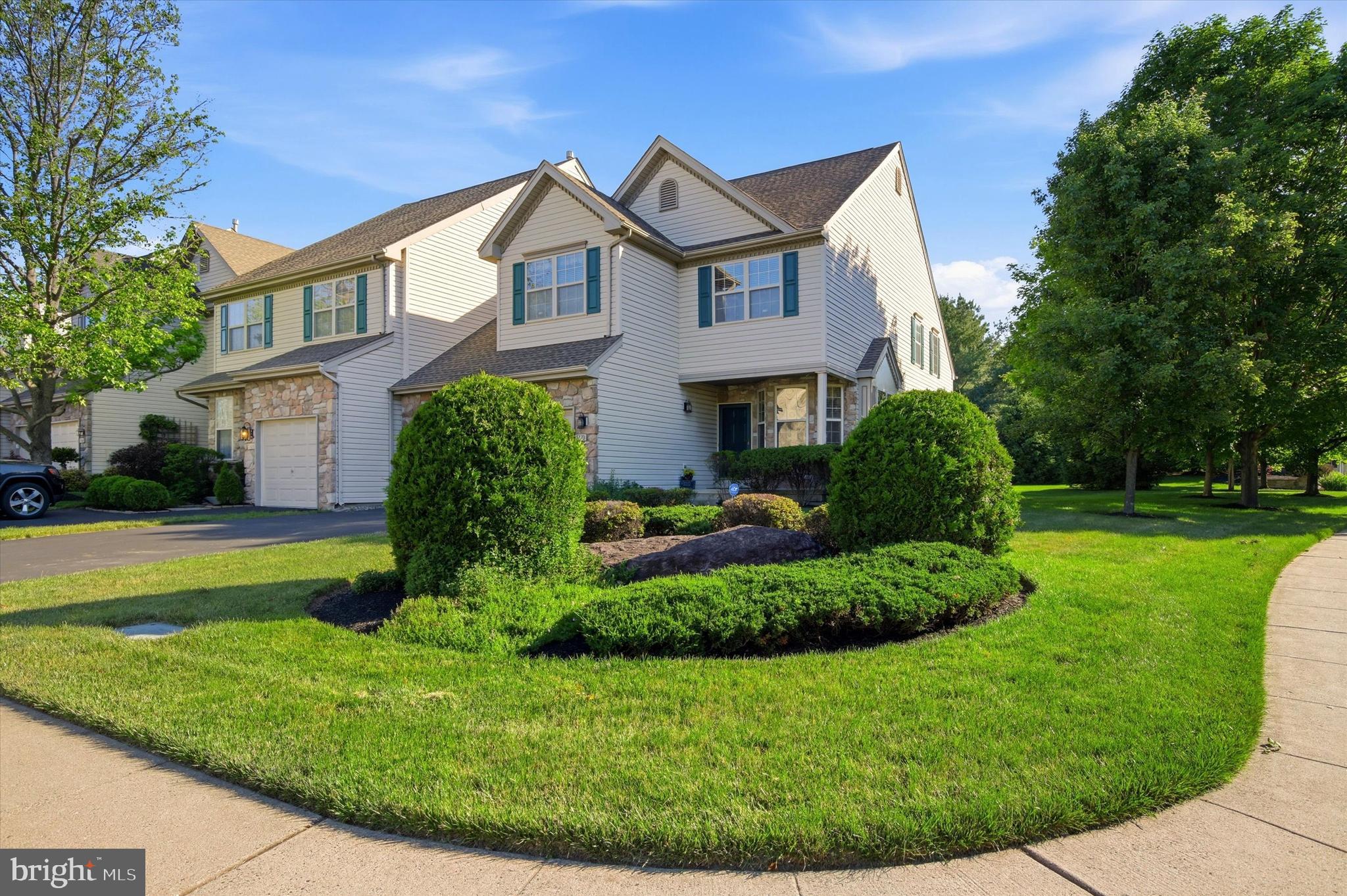 Welcome home to this 3-bedroom, 2.5-bath end unit townhome in the desirable Fireside Development in Buckingham Township. Boasting an impressive 3,203 square feet of main living space plus an additional 778 square feet of finished basement, this home offers the space and functionality today's buyers are seeking.

Step inside to experience the dramatic two-story family room, where soaring ceilings and a cozy fireplace create an inviting focal point perfect for gathering with family and friends. The open floor plan flows seamlessly throughout the main level, offering both grandeur and warmth in equal measure.
With three generous bedrooms and 2.5 well-appointed bathrooms, this home provides comfortable accommodations for the entire family. The thoughtful layout maximizes every inch of the home's expansive square footage.

The finished basement is a true bonus, adding valuable living space that can serve as a recreation room, home theater, home gym, office, or playroom—the possibilities are endless with an extra 778 square feet at your disposal.

As an end unit, this townhome offers additional natural light, enhanced privacy, and the convenience of an attached garage—a rare and highly sought-after feature in townhome living. No more scraping ice off your windshield or unloading groceries in the rain!

Located in the prestigious Fireside development and the heart of Buckingham, you'll enjoy proximity to top-rated Central Bucks schools, charming downtown shops and restaurants in Doylestown Boro, parks, and convenient access to major routes for easy commuting.

This is your opportunity to own a spacious, well-designed end unit townhome with nearly 4,000 total square feet in one of Bucks County's most desirable communities. Schedule your private showing today and experience all this exceptional home has to offer!