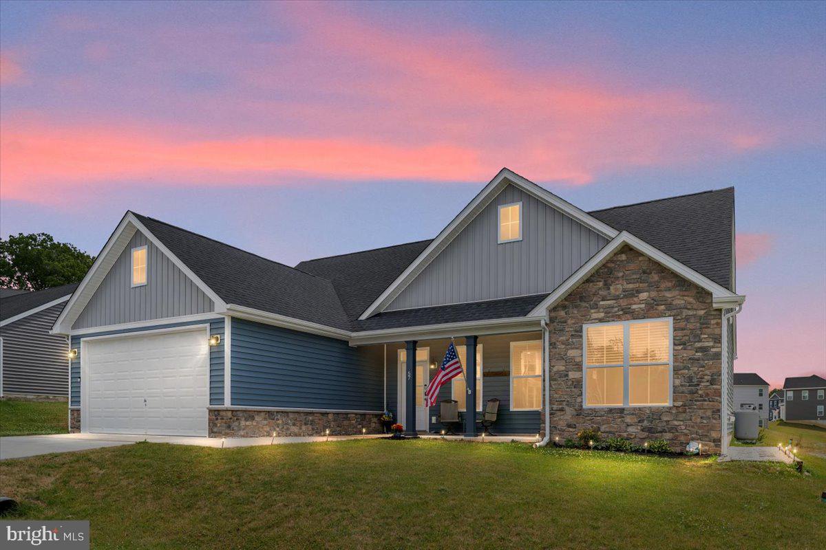 Welcome to effortless one-level living at 57 Cilantro Lane in Bunker Hill! Built in 2022 and thoughtfully designed for comfort and convenience, this beautifully maintained home offers true stair-free living both inside and out.  Be sure to check out the 3D Tour and walk through the house with your mouse!<br><br>

Step inside to an open, airy floor plan highlighted by soaring vaulted ceilings, abundant natural light, and attractive finishes throughout. The spacious main living area currently showcases a concert grand piano, demonstrating the generous scale of the room while still offering plenty of space for a traditional living room furniture arrangement.<br><br>

The well-appointed kitchen features granite countertops, ample cabinetry, stainless steel appliances, and a large island perfect for everyday living and entertaining. Just beyond the kitchen, the inviting sunroom serves as an additional living space and is highlighted by a cozy gas fireplace, creating the perfect setting for relaxing, reading, entertaining guests, or enjoying your morning coffee year-round.<br><br>

The oversized primary suite provides a peaceful retreat with a spacious bedroom and an easy-entry walk-in shower designed for comfort and accessibility. Additional features include a two-car garage equipped with a mini-split system, creating a versatile conditioned space ideal for a workshop, hobby area, fitness room, or additional storage needs.<br><br>

Outside, enjoy relaxing mornings and summer evenings beneath the gazebo-covered patio. The gazebo includes screening panels, allowing you to enjoy the outdoors while helping keep seasonal pests at bay.<br><br>

Conveniently located near major commuter routes, shopping, dining, and everyday amenities, this home offers the perfect combination of modern construction, low-maintenance living, and practical comfort. Whether you're looking to simplify your lifestyle or enjoy the ease of single-level living, this exceptional property is ready to welcome you home.<br><br>

Schedule Your Private Showing Today!