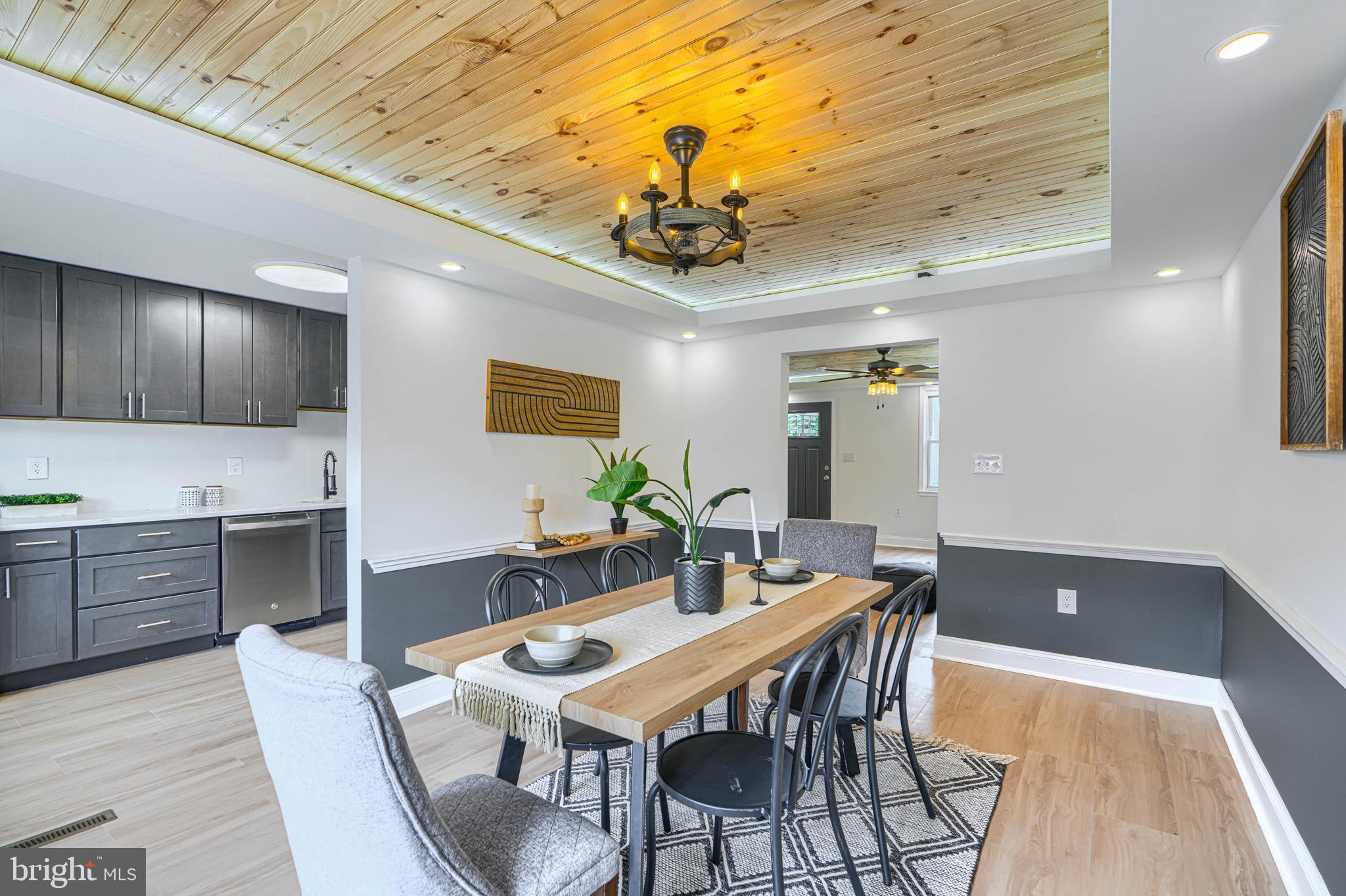 Welcome to 1905 Heathfield, a beautifully updated and modern 5-bedroom, 2.5-bathroom home that combines style, comfort, and functionality. As you approach the home, you are greeted by a welcoming covered front porch. Inside, the main level features a spacious living room with a striking wood accent ceiling, a cozy built-in fireplace, and a convenient powder room. The dining room is full of character with its tasteful design, making it the perfect space for entertaining. The gourmet kitchen is a chef's dream, complete with stainless steel appliances, quartz countertops, and an abundance of cabinet space. The second level offers three generously sized bedrooms and a luxurious full bathroom. The top level provides an additional spacious bedroom, perfect for a private suite, guest room, or home office. The fully finished basement expands the living space with a recreation room, a fifth bedroom, an additional full bathroom, and a dedicated laundry area. Step outside from the kitchen onto the rear deck, overlooking the backyard with the convenience of a private driveway. This move-in ready home offers modern finishes, ample living space, and thoughtful updates throughout.