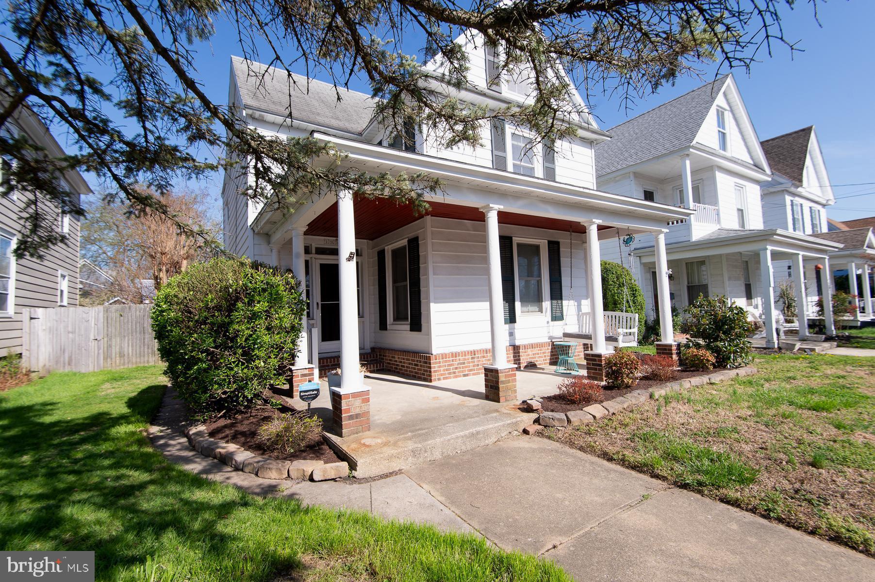 Charming and thoughtfully updated, this move-in ready 3BR/2BA water-view farmhouse is ideally situated on a quiet street in the Cambridge Historic District.

A welcoming covered front porch leads into a bright entry and dining space, with classic pocket doors opening to the living room. The kitchen is well-appointed with wood cabinetry, crown molding, granite countertops, and stainless steel appliances. A full bath with a walk-in shower and timeless black-and-white tile completes the main level.

Upstairs, you’ll find two generously sized bedrooms and a spacious primary suite.

The outdoor space offers a private, garden-style setting with a patio, tiered beds, a shed with electric, and an enclosed porch. Recent upgrades, including HVAC and a tankless hot water heater, provide added comfort and efficiency.