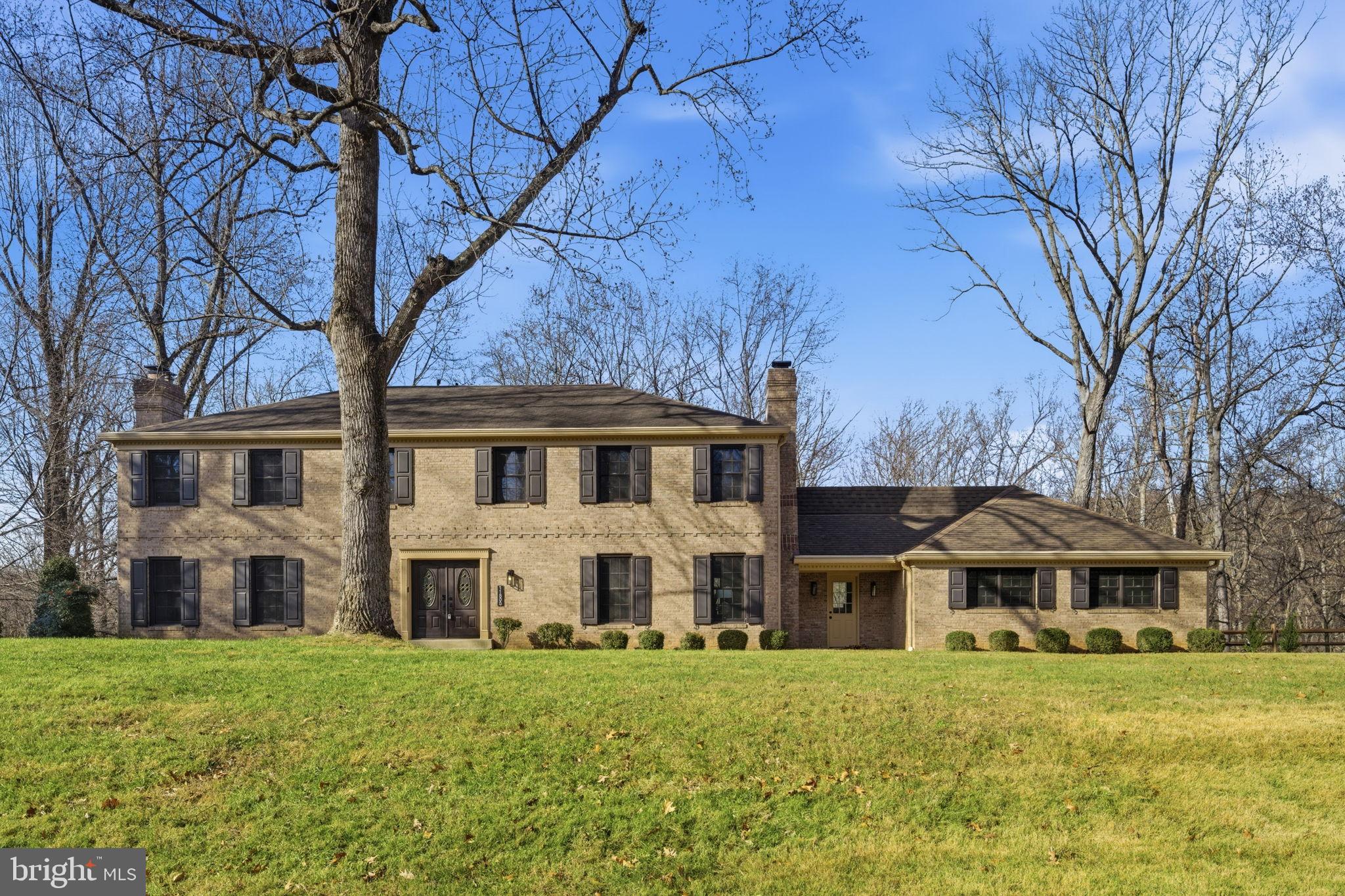 Welcome to 11800 Beekman Drive. Tucked away on a quiet cul-de-sac and featuring a rarely available one-acre lot that backs to woods and protected parkland, this property offers the kind of privacy and natural surroundings that bring everyday peace of mind.

The moment you walk in, the high ceilings and two-story foyer make a stunning first impression, leading to a formal living room filled with natural light and anchored by a cozy wood-burning fireplace. The main level feels open and bright throughout, with warm finishes and a layout that works beautifully for both everyday living and entertaining. The spacious dining areas and comfortable family room give you plenty of space to unwind or gather with friends and family.

The kitchen has been thoughtfully elevated with high-end quartz surfaces, a Sub-Zero refrigerator, premium appliances, and quality designer touches. Across the home, you'll appreciate upgraded fixtures, custom details, and three fireplaces that add warmth and character—especially as winter approaches. A large main-level office provides a quiet, dedicated space for working from home with great natural light.

Upstairs features five bedrooms and four full bathrooms. The generous primary suite feels like a boutique spa with double sinks, a stunning walk-in shower, a freestanding soaking tub, and an elegant, curated design.

The walk-out lower level is bright and functional, offering full daylight, a large bedroom, a full bathroom, and a wood-burning fireplace—an ideal setup for guests, extended family, or a separate living area. The expansive recreation space allows for a home gym, entertainment room, hobby space, or additional office—whatever fits your lifestyle.

Outdoor living is a standout feature, highlighted by a huge brand-new Trex deck overlooking your private wooded view—perfect for morning coffee, evenings with friends, or simply enjoying the peaceful setting. A large driveway adds convenience and ample parking.

Enjoy the best of both worlds—privacy, space, and nature—while being just moments from Potomac Village, shopping, restaurants, and top-rated schools. This is a home you will not want to miss.