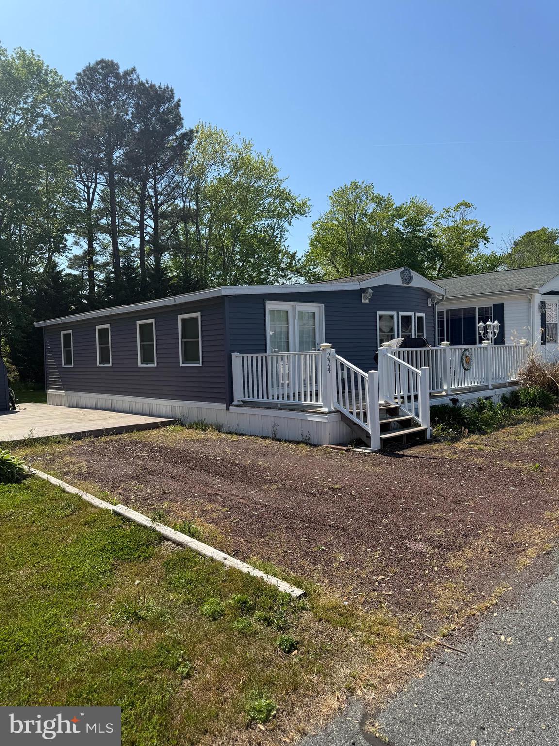Welcome to White Horse Park ! Charming coastal cottage located in the sought-after White Horse Park community! This adorable 2-bedroom, 1 full bath home offers the perfect beach getaway retreat. Nestled on a private lot backing to trees, you’ll enjoy a peaceful setting with plenty of room to relax and unwind. The spacious deck is ideal for outdoor dining—perfect for enjoying steamed crabs after a day at the beach. White Horse Park amenities include a community pool, marina, boat ramp, and more, making this a fantastic opportunity to own in a vibrant waterfront community. You own the land NO ground rent.