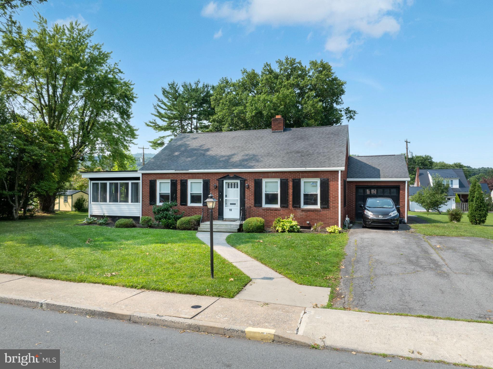 Loads of charm on a great street in Lewistown Borough! This inviting 1.5‑story home offers 3 bedrooms and 2 baths on a generous .43‑acre lot close to all the conveniences Lewistown has to offer. The exterior showcases a classic brick façade accented by nicely maintained garden beds and mature shrubs. Step inside to a bright foyer with tasteful LVP flooring throughout much of the main level, light walls, and stylish fixtures. An arched doorway leads into the living room, adding a touch of character. The open living and dining areas provide comfortable everyday living, with the dining room featuring charming corner built‑ins and large windows. A delightful light-filled sunroom sits just off the living room, where a brick wood‑burning fireplace creates a cozy year‑round retreat. This versatile space can serve as a home office, reading nook, or additional family room. The kitchen is nicely updated and offers ample storage with a pantry and plentiful cabinetry, along with convenient access to the back patio. Down the hall, you’ll find a well‑appointed full bath, a main‑floor bedroom, a laundry nook, and access to the 1‑car garage. Upstairs, two additional bedrooms, a full bath, and a cedar closet complete the second level. The unfinished basement provides excellent storage and offers possibilities for a workshop, workout area, or hobby space. Great value for the space and location - see it today!