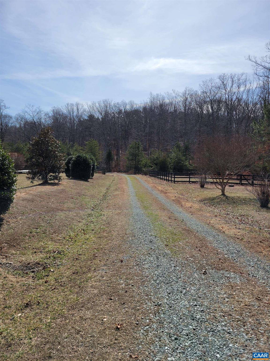 The possibilities are endless! This unparallel, rare parcel of over 14 acres offers the convenience to amenities, has easy access with state maintained roads, and with-in 25 mins to Charlottesville. NO HOA. Best of both worlds.  This property offers complete privacy, but just 2 mins to restaurants, doctors offices, stores, and coffee shop. The gently rolling landscape offers a possible elevated homesite and a completed driveway to lot. Mature hardwoods, a stream, and an abundance of wildlife complete this one of a kind location.