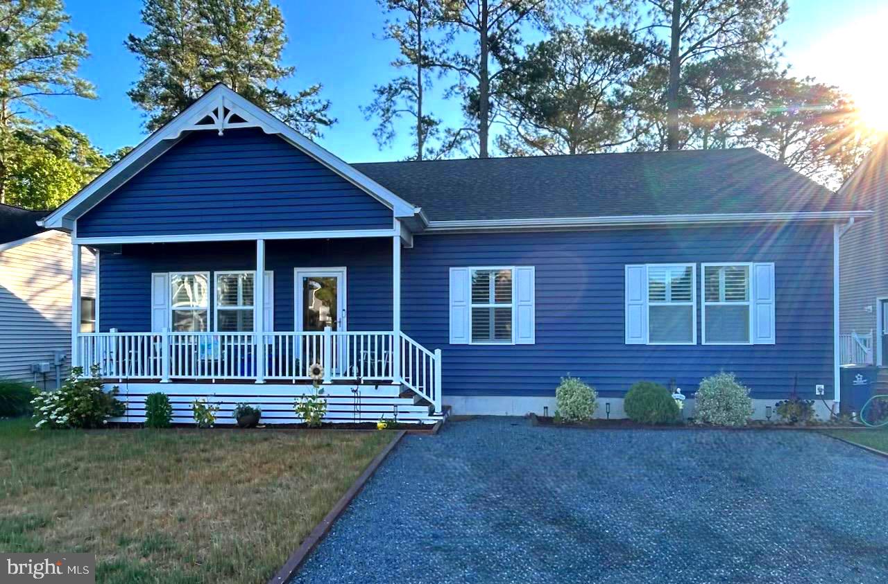 Nestled in a tranquil setting within the sought-after Ocean Pines community, this beautifully maintained 3-bedroom, 2-bath home offers comfortable coastal living. Just five years young, the home features an open-concept floor plan designed for easy everyday living and entertaining. Relax on the inviting front porch or enjoy the peaceful surroundings from the spacious three-season room. Situated across the street from the water, this property provides a serene backdrop while remaining close to all the amenities Ocean Pines has to offer. A wonderful opportunity to enjoy a low-maintenance lifestyle in a picturesque location. Views of the Water, great location to access Restaurant, shopping, local attractions and so much more....   Professional Pictures will be Posted Soon!