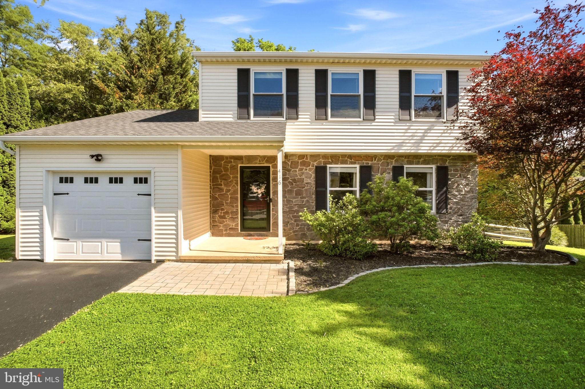 Welcome to 416 W. 6th Avenue! Nestled in the desirable Parkesburg Knoll community, this beautifully updated 3-bedroom, 2.5-bath Colonial combines timeless design with today's modern finishes. From the moment you arrive, you'll appreciate the attractive curb appeal, manicured landscaping, and inviting presence that make this home stand out.  Step inside to a spacious entryway featuring a convenient coat closet, updated powder room, and fresh neutral paint that continues throughout the home. New luxury vinyl plank flooring flows seamlessly across the entire first floor, creating a warm and cohesive feel. The sun-filled formal living room offers flexible space for everyday living or a home office and opens effortlessly into the formal dining room, highlighted by a stylish modern light fixture—perfect for entertaining. The completely refreshed kitchen is sure to impress with crisp white cabinetry, new quartz countertops, stainless steel appliances, contrasting finishes, and a center island that provides additional prep space and casual seating. A bright breakfast area overlooks the backyard and offers direct access to the expansive rear deck. The dramatic two-story family room is the heart of the home, featuring soaring vaulted ceilings, abundant natural light, and a cozy fireplace that creates the perfect gathering space for family and friends. Upstairs, the spacious primary suite offers a peaceful retreat with two closets and private en-suite bathroom. Two additional generously sized bedrooms and a full hall bathroom complete the second level.  The walk-out lower level offers excellent storage and presents endless opportunities to finish into additional living space, a home gym, recreation room, or media room. Step outside to enjoy one of this home's standout features—a large covered deck complete with a stunning pergola, ideal for outdoor dining, entertaining, or relaxing in the shade. The fully fenced backyard provides plenty of room for pets, play, and gardening while offering privacy and space to enjoy the outdoors. With tasteful updates including new quartz countertops, freshly painted white kitchen cabinetry, updated flooring, a fresh neutral color palette, spacious living areas, and exceptional outdoor entertaining space, this move-in ready home offers the perfect blend of comfort, style, and functionality. Schedule your private showing today!