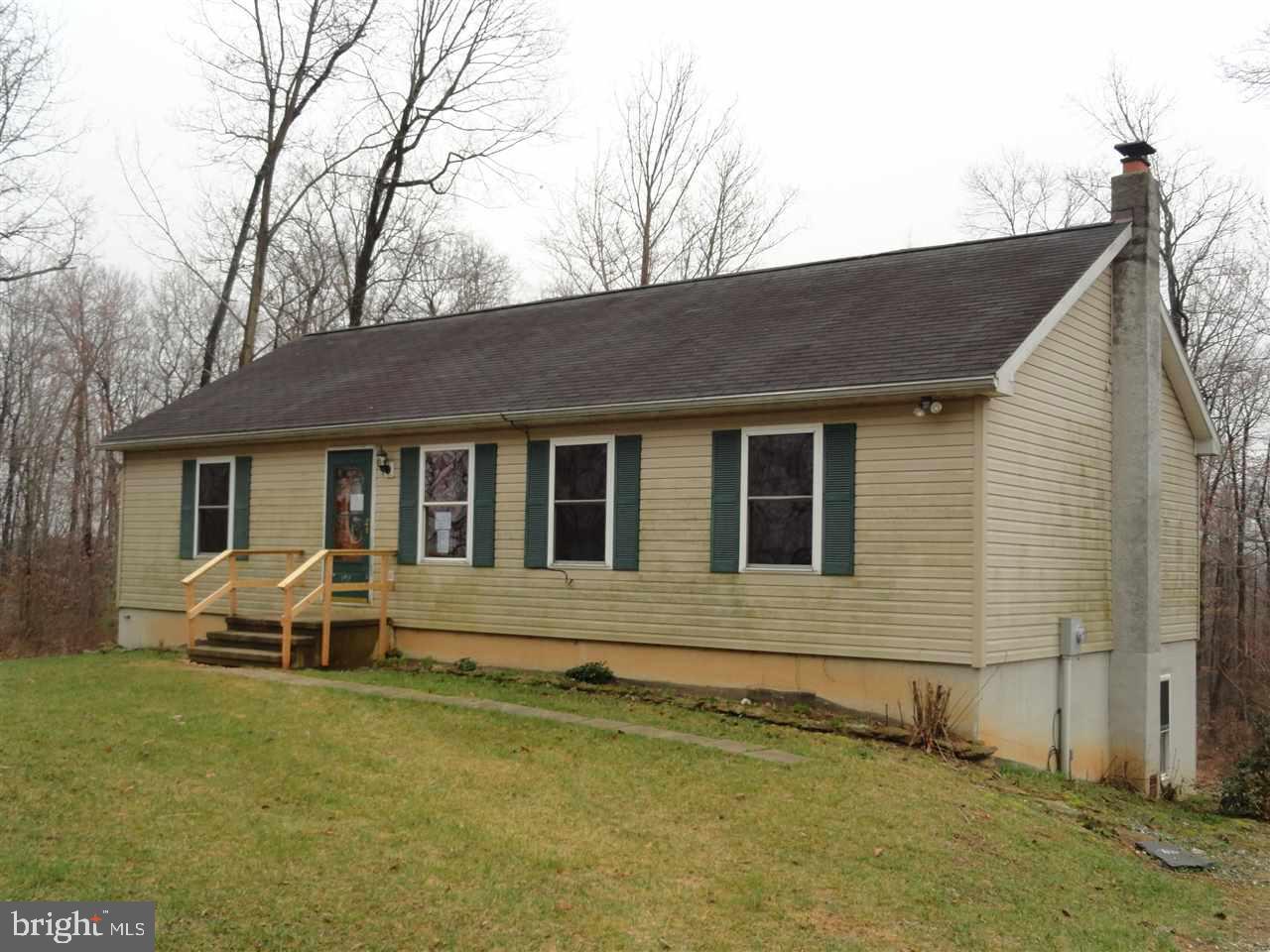 Private setting on a 2 acre lot with this 3BR, 2 bath Rancher.  Totally finished walk out basement.  Master bedroom with full bath, large living room, dining area, and more.  Sit on the large deck and enjoy nature.  Easy commute to Maryland.