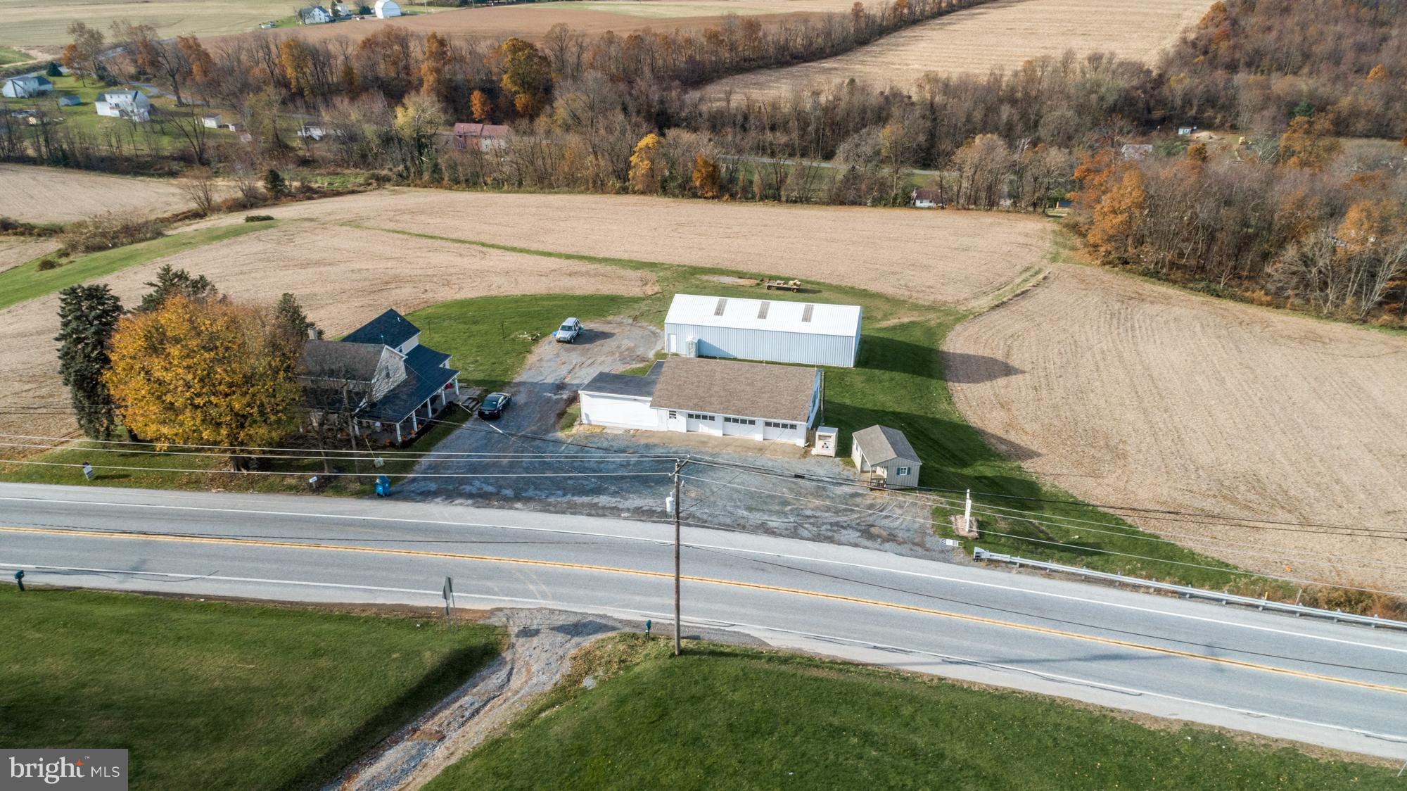 2 separately deeded properties are included. The first property is 752 Lancaster Pike, a farmhouse on .48 acres. This house is rented and the tenants would like to stay, but are on a month to month lease. The second property is on 19 acres and features a large pole barn and a 3 bay garage with a walk in fridge, back storage, and parking area. The land and the market is rented through the end of the year. There is access to the 19 acres from Truce Road.