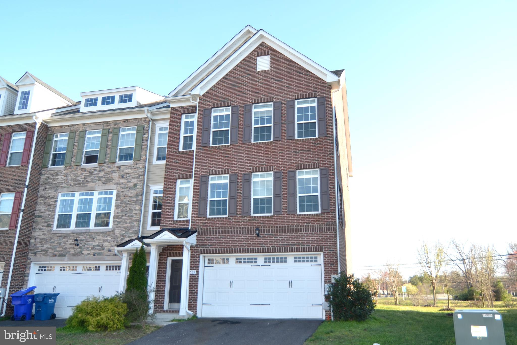 Luxurious three level end unit brick front 3BR 3FB townhome w/2 car garage.  Entry/lower rear walkout level features a large recreation/family room w/full bath and 2 car garage.  The main level has plenty of windows to allow the sun light to spill through the open floor plan.  The kitchen features granite counter tops, breakfast bar, pantry as well a large table area.  Additionally there is a formal dining area with butlers pantry and the large living room on the front of the home.  On the upper level are three bedrooms, one being the master suite with double walk-in closets and a large master bathroom featuring double sink vanity and an over-sized shower.  The washer and dryer are conveniently located on the bedroom level.