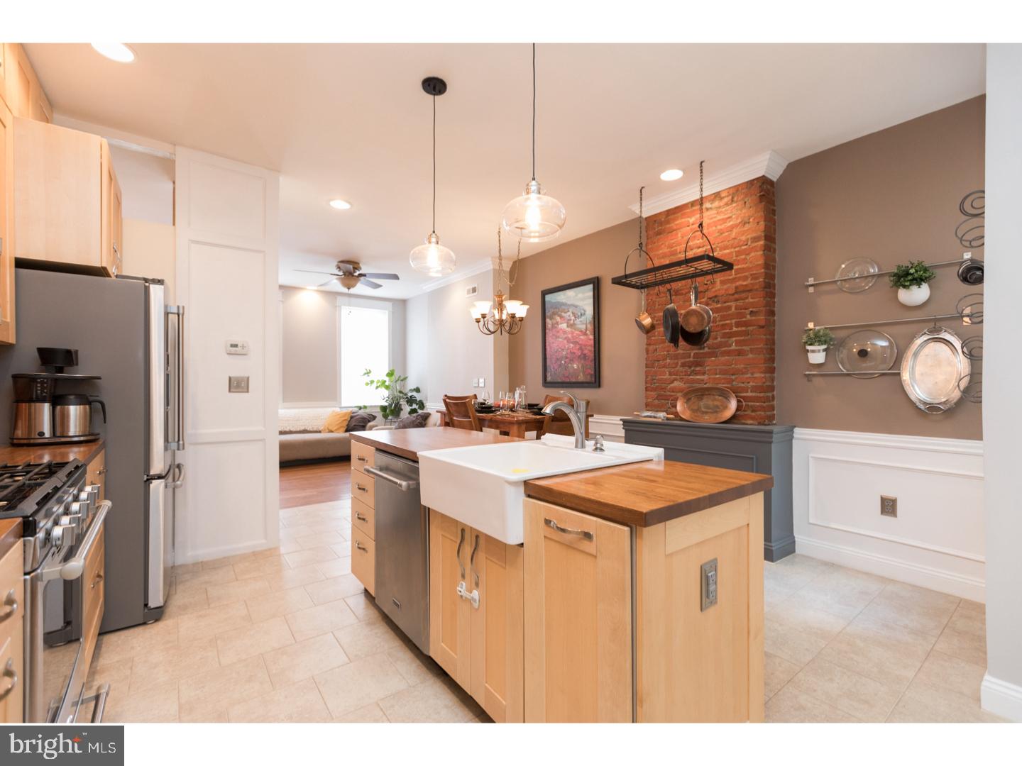 We love this 4 bedroom 2.5 bath 3-story home with over 1800 sq ft of living space and located in the highly desired South Kensington neighborhood. This home has tons of creature comfort's, attention to design, and timeless features. Every room has a *special touch* added like exposed brick, wood and stone elements, or accents such as wainscoting, recessed lighting, high ceilings, crown molding... The main floor open concept layout features a modern kitchen w/ farmhouse sink, waterproof solid butcherblock countertops, stainless appliances, 42" ceiling-height cabinets, pot rack, a breathtaking stone wall feature, and large walk-in pantry. The laundry room is conveniently located on the 1st-floor w/ front load W/D, plenty of folding space, and there is a full bath on the main level. The 2nd-floor has a 2 BR including the owner-suite w/ exposed beams and the 3rd-floor has 2 more lovely sun filled rooms each with so much character! There is a total of 9 closets throughout and endless storage in the 600sf basement which, btw, can be used as a play room/storage/creative space/etc. Bathrooms are updated and modern w/ pristine impeccibly paired subway and custom tile. Extra special info: Roof access w/ the potential for a lower and/or upper deck, charming yard with room to grill and chill, a one of a kind wood-clad exterior feature, 6' premium fencing, insulated and weather-sealed home (extremely low heating costs), dual-zoned high preformance HVAC, custom magnetized panels in front windows for sound and insulation, new water main, white reflective roof, all appliances included. Easy access to Center City with only a 4-10 min commute! You are going to fall in love with this home. We welcome your visit! Offers are due and to be presented by May 13th.