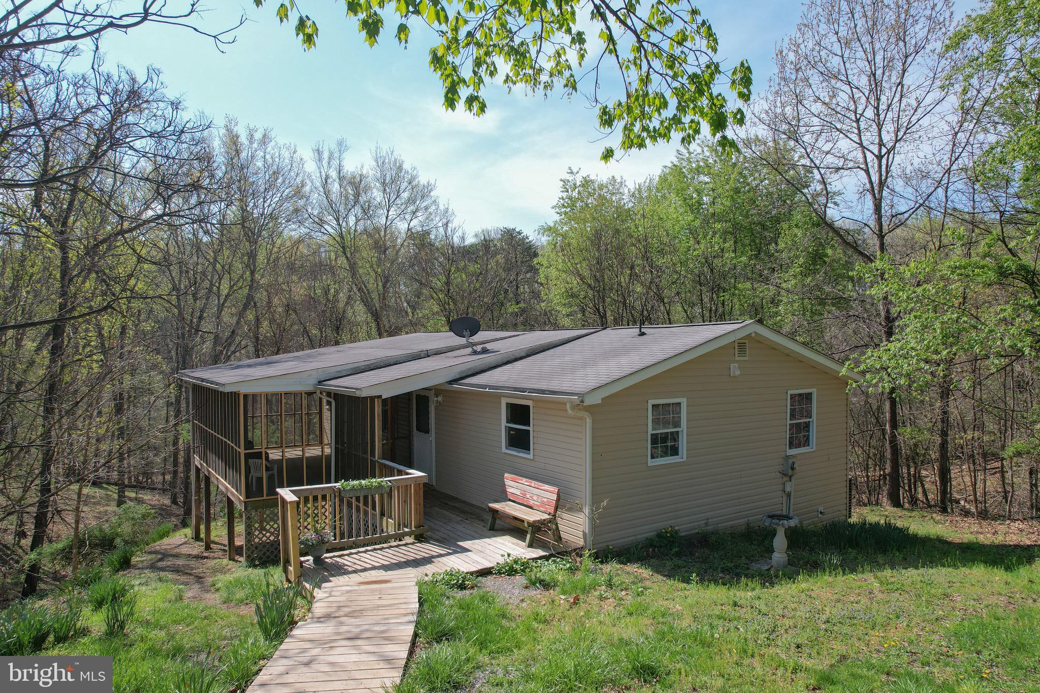 Multiple offers received- OFFER DEADLINE is 12pm noon on Saturday 12/25.  

Tucked away on nearly 4 acres of peaceful countryside, this beautifully updated 2-bedroom, 1-bath home offers the perfect blend of privacy and modern comfort. Surrounded by nature and free from HOA restrictions, you’ll enjoy the freedom to truly make this property your own.

Inside, you’ll find thoughtful updates throughout, including brand new carpet, stylish new cabinets, updated countertops, a fully remodeled bathroom, and a new HVAC system for year-round comfort. A versatile bonus room adds even more flexibility—perfect for a home office, extra bedroom, recreation space, or hobby room.

Step outside to unwind on the screened and covered porch—ideal for relaxing mornings, quiet evenings, and taking in the serene surroundings. This property provides plenty of room to roam, garden, or bring your animals, complete with a horse run-in shed already in place.

If you’ve been searching for a private retreat with modern updates, functional space, and room to breathe, this is the one!