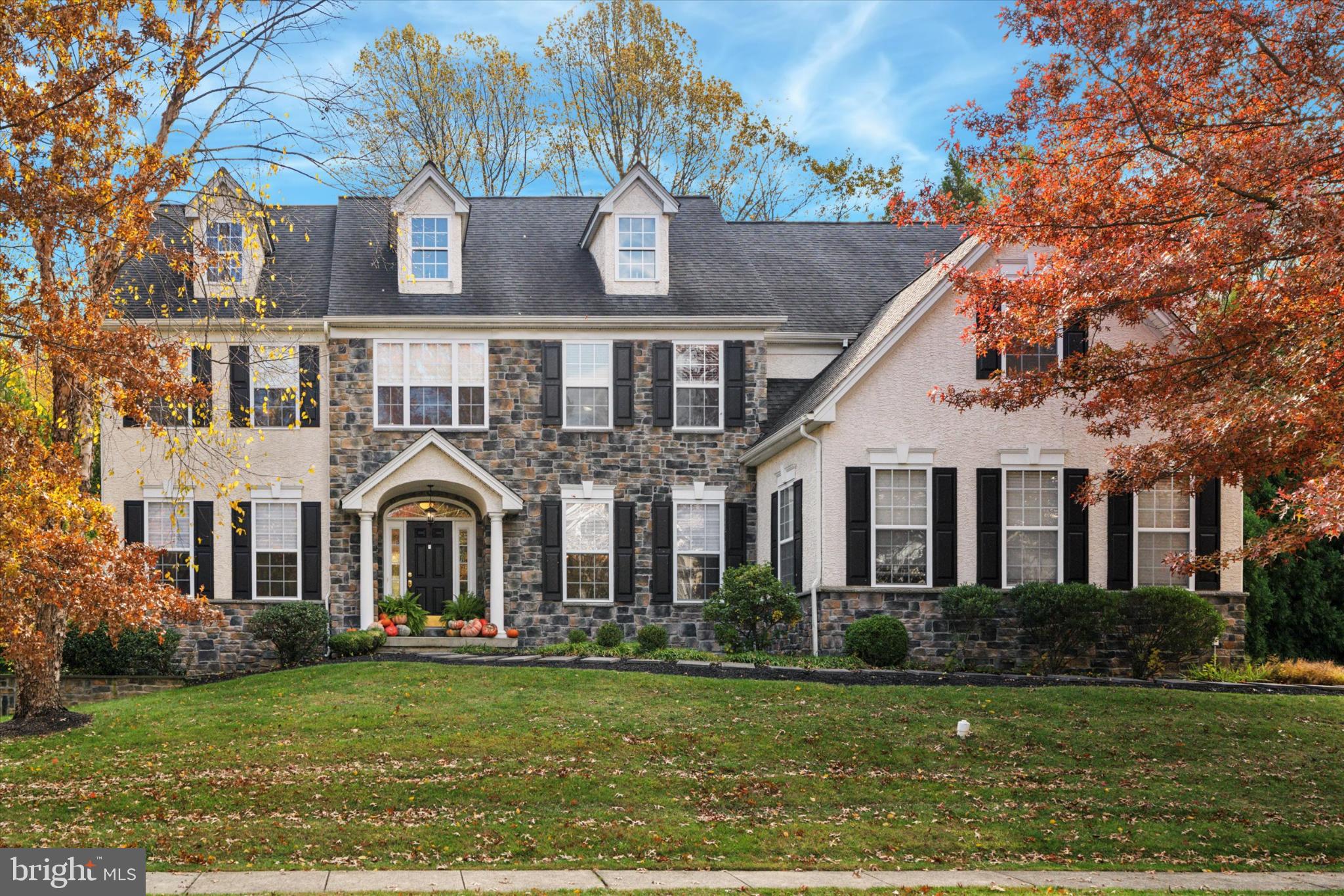 Welcome to this showstopper of a home in the highly sought-after Reserve at Hunter’s community, located within the award-winning Garnet Valley School District. Perfectly situated on a quiet cul-de-sac, this property offers elegance, space, and luxury around every corner. Step through the front door into a stunning two-story foyer with rich black walnut hardwood floors. The main level features formal living and dining rooms adorned with crown molding and recessed lighting—ideal for hosting gatherings. A private office/study with double doors provides a quiet retreat for work or study. At the heart of the home is a completely renovated chef’s kitchen, showcasing an expansive 102-inch island, white cabinetry, granite countertops, a double oven, 5-burner gas cooktop, built-in drawer microwave, and stainless steel refrigerator. The light-filled breakfast room, highlighted by a ship-lapped tray ceiling, opens to a cozy family room with a gas brick fireplace and matching ship-lapped surround that extends to the ceiling. Completing the main level is a stylish powder room, a mudroom with a built-in bench and three open lockers, as well as access to driveway or to the immaculate three-car garage and secondary staircase. Upstairs, the luxurious primary suite is a true retreat—featuring tray ceilings, a sitting area, two walk-in closets, and a beautifully renovated spa-style bathroom with dual quartz vanities, a tiled walk-in shower, heated floors, a ThermoMasseur air jet tub, linen closet, and private water closet. Four additional spacious bedrooms, each with large closets, share two updated full bathrooms (one Jack-and-Jill and one hall bath with quartz vanity). A conveniently located second-floor laundry room with cabinetry and new Speed Queen washer and dryer completes this level. The fully finished walk-out basement offers over 1,600 square feet of additional living space. Enjoy a built-in entertainment center, a second kitchen/butler’s pantry with granite counters, refrigerator, and dishwasher, plus areas for gaming, fitness, or entertaining. A bonus room with an attached full bath makes the perfect guest suite, playroom, or second office. There’s also a large unfinished storage area for all you additional storage needs. Outside, the paver patio is perfect for entertaining or relaxing while overlooking your private, tree-lined backyard. With a three-car garage, a wide driveway, and a peaceful cul-de-sac location, this home combines beauty, function, and tranquility. Close to major routes, shopping, and dining, this spectacular home & property truly has it all—style, space, and sophistication. Don’t miss the chance to make this exceptional Garnet Valley home yours!