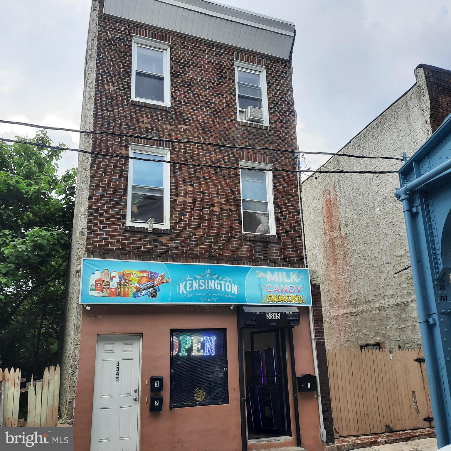 All showings must be accompanied by an agent.  Do not disturb store employees.
Kensington Ave: a Brick and Stucco Mixed use building consisting of an occupied first floor commercial unit, and 2 occupied residential units (both are 1 bed/1 bath apt units) on the second and third floors above.  The building is approx 2100 sq ft and has plenty of on street parking.
The commercial unit is currently a productive new Convenience Store with a 3 year lease & automatic rental increases.  In 2025 the commercial unit rent is $1400/month.  
The two apartment units have current leases of $800 and $750/month respectively.  The leases in total currently produce a net income total of  $2950/month. 
All of the units were renovated in 2020.
This income producing  building in the Kensington section of Philadelphia is close to the El, Kensington Works and many new businesses.
Building is in very good condition and is being sold as-is.