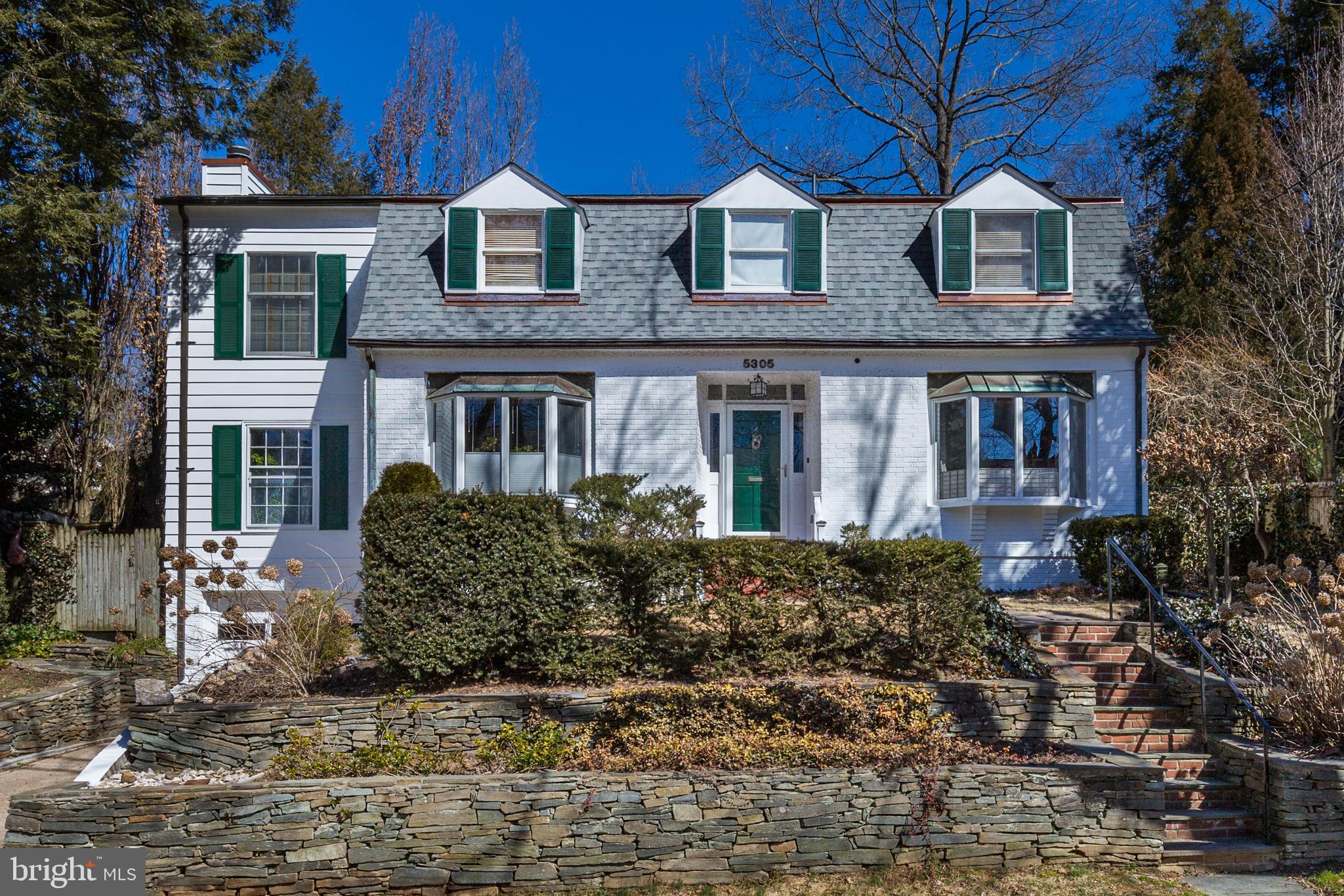 Charming 4 bedroom, 3.5 bath colonial with lovely landscaping available near Little Falls Stream Valley Park in Bethesda, ideally located in a quiet neighborhood off of Mass Ave, half a mile from the DC line. The main floor features a home office, family room with gas fireplace, powder room, living room- dining room combination with wood-burning fireplace and deck access. A mid-century modern style kitchen with quartz countertops, gas range, and wood cabinetry completes the floor. All four bedrooms are on the upper level. The primary bedroom has vaulted ceilings and an adjoining bath. The second bedroom has an en suite bath. The third and fourth bedroom overlook the street. The upper level hallway also has walk up access to the floored attic, an ideal place for storage. The lower level has a large recreation room with additional wood-burning fireplace, garage access and another full bath. Little Falls Stream Valley Park facilities include soccer fields and a playground. It also connects with the Capital Crescent Bike Trail and The Creekside Trail.  2 miles from the Potomac River and  Sibley Memorial Hospital.  5.6 miles from The White House. Comfortable living awaits you on Falmouth!