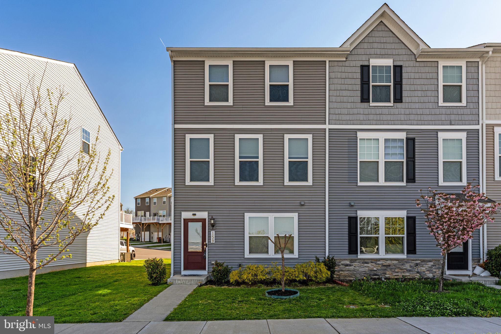 Enjoy low-maintenance living with modern style, everyday convenience, and added opportunity in this end-unit townhome in Presidents Pointe. Built in 2021 and ideally located in Ranson, this home is close to shopping, restaurants, and Route 9, making daily life and commuting easy. Qualified buyers may also benefit from income-based first-time homebuyer grants and community partner grant programs, making this property an even more attractive option.

Inside, the open main level features 9+ ft. ceilings, luxury vinyl plank flooring, and a bright, inviting layout designed for comfortable everyday living. The kitchen offers stainless steel appliances, quartz countertops, a farmhouse sink, and a center island perfect for gathering, dining, or entertaining. The adjoining dining area is filled with natural light, while the living area opens to a deck for outdoor enjoyment. A half bath completes the main level.

The entry level includes a carpeted den with flexible use as an office, media room, workout space, or retreat, along with a laundry area and interior access to the rear-entry 2-car garage with new epoxy flooring.

Upstairs, the primary suite features a large walk-in closet, ceiling fan, and private ensuite bath. Two additional bedrooms and a second full bath provide space for guests, hobbies, or working from home. Additional features include Ethernet ports in every room, a programmable smart thermostat, 62-gallon water heater, video doorbell, and security system.

A convenient location, modern finishes, and possible grant assistance for qualified buyers make this home a compelling opportunity in Presidents Pointe.