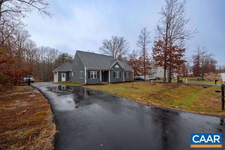 Quick commute to Charlottesville, UVA, Zion Crossroads and I-64E! This striking one level, Baird Snyder quality home with 3 bedrooms 2 baths, lacks nothing! Located in lovely, peaceful, Sycamore Landing. From the gorgeous, soaring 9' ceilings high end, eat-in kitchen complete with granite counters and island, tall cabinets, walk in pantry stainless appliances, overlooking the spacious Great room with gas fireplace and surround sound, this place feels like home! Primary bedroom and bath are pristine with huge closet and tiled walk in shower. All bedrooms have over-sized closets! Love nature? Walk out onto your welcoming screened in porch, overlooking level, half acre private yard, bordered by trees!  Recent upgrades lvp flooring, dishwasher, hot water heater, paint and paved driveway. Huge walk up attic is ready for expansion and tons of storage. Privacy and convenience, one level living..it can be YOURS!,Granite Counter,Fireplace in Great Room