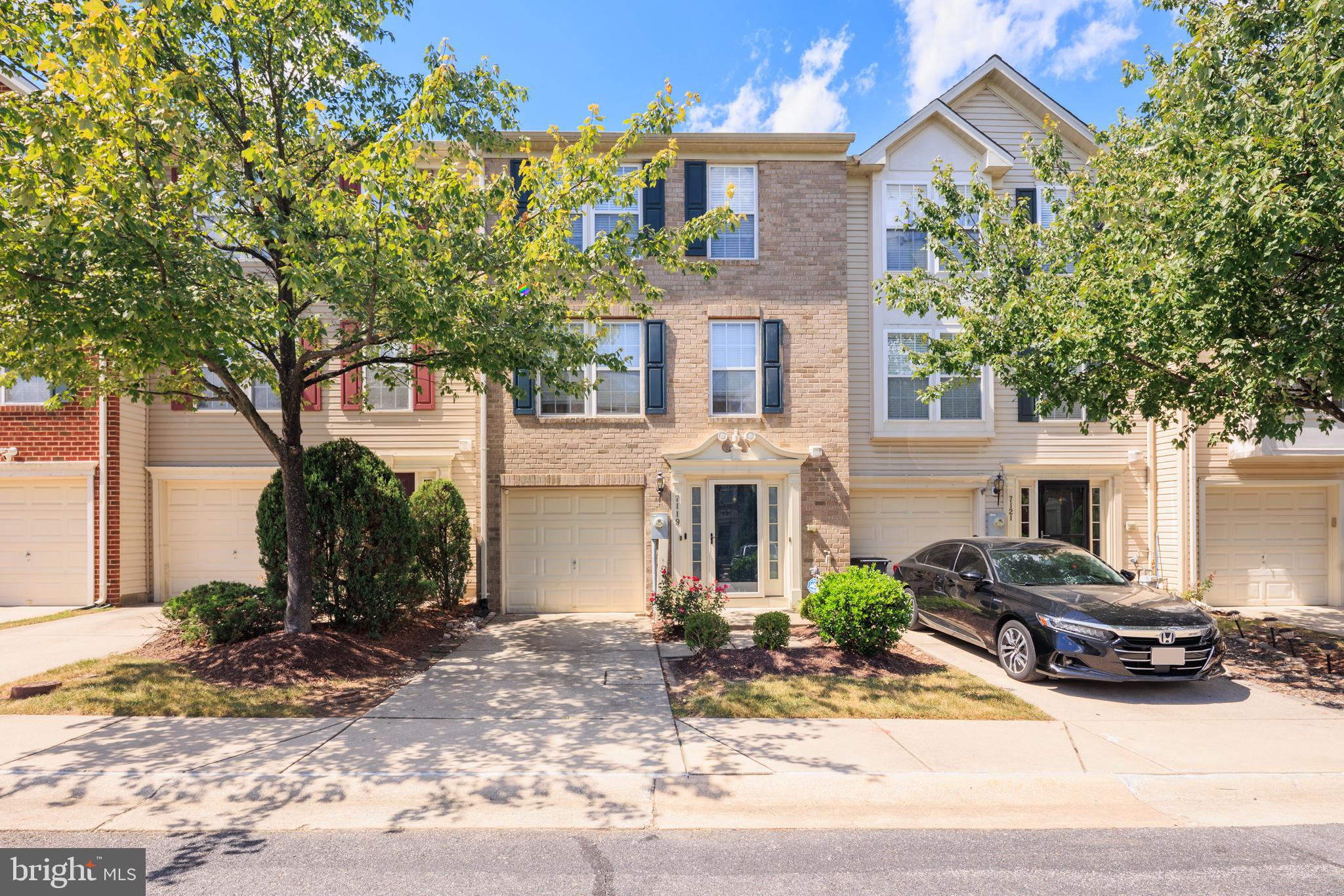 This rare opportunity sets the stage for a stunning Colonial townhome-style condo in the sought-after Village Townes community of Elkridge. Step inside through the welcoming front entry or the spacious one-car garage and you’ll find a bright foyer with a convenient powder room, leading into a generous family and recreation room accented by a modern feature wall with built-in cabling.

The main level offers a seamless living and dining combination with custom bookshelves, abundant natural light, and plush carpeting for relaxed comfort. At the heart of the home, the chef’s kitchen stands ready for gatherings of every kind, featuring stainless steel appliances, a center island with breakfast bar, a walk-in pantry, and plenty of storage. The rare eight-foot bump-out adds exceptional space for entertaining, flowing directly onto a private deck overlooking a peaceful wooded backdrop.

Upstairs, the owner’s suite serves as a true retreat with a vaulted ceiling, walk-in closet, soaking tub, and walk-in shower. Two additional bedrooms and a full bath complete the level with comfort and style.

Perfectly located near US-1, I-175, and I-95, this home offers both convenience and tranquility, with easy access to dining, shopping, and entertainment.  This listing is a short sale and all offers are subject to third party lender approval.