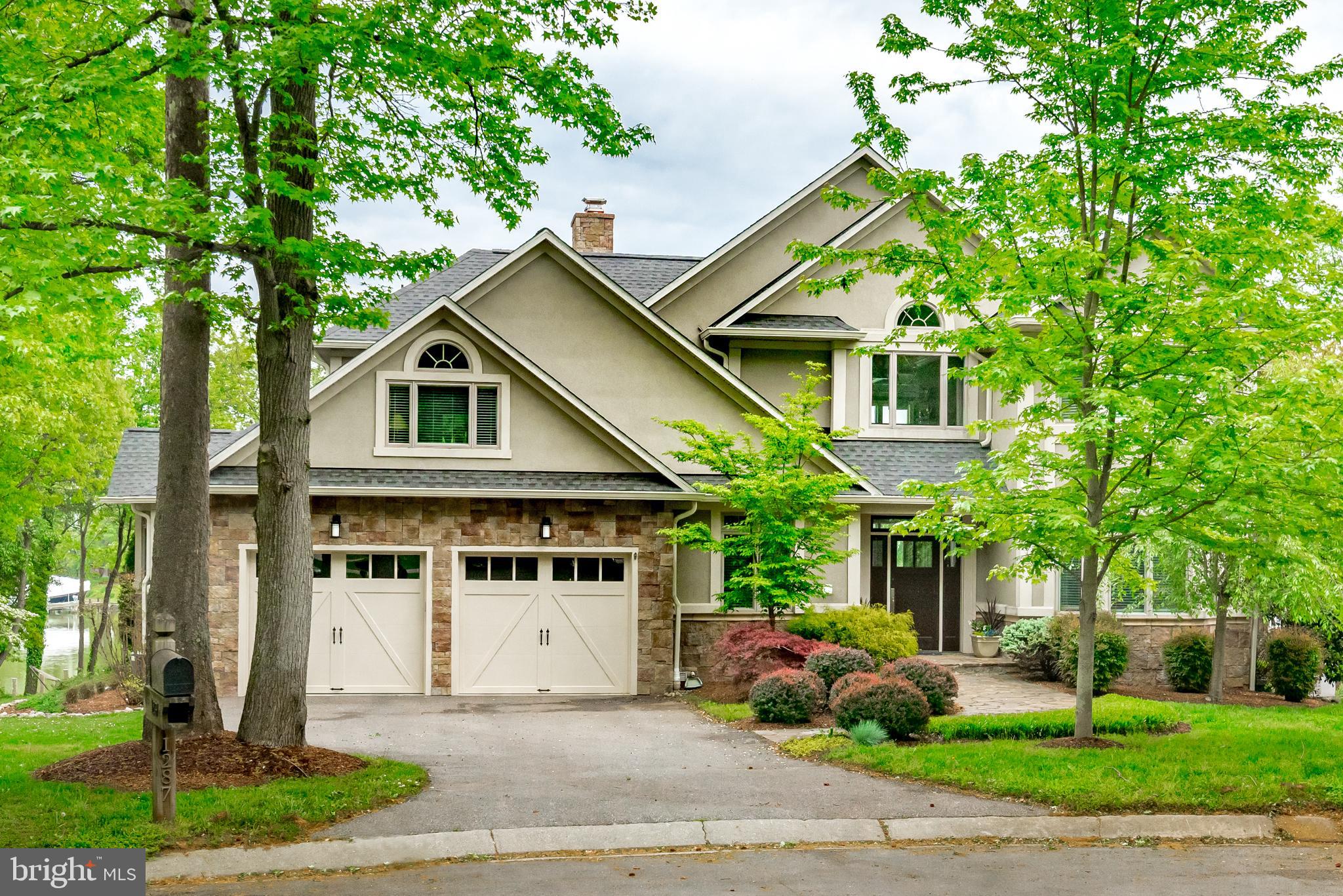 **Appraisers:  This sale was a cash transaction but the buyers got a loan and the property did appraise for the sales price. ** Elegant, spacious and light-filled Waterfront home in sought-after Annapolis Cove with access to the Bay Ridge pool! Sit and look at your boat on protected Lake Ogleton. Main level, primary bedroom with multiple bedrooms with ensuite options throughout the house. Water views abound in this beautiful home!  If you need home offices AND bedrooms for family or visitors, this is the home for you.  Indoor versatility and open-concept with multiple ways to enjoy your yard and the Chesapeake Bay.  Departing from your private, deep-water, protected dock, you can arrive in downtown Annapolis in 15 minutes for sunrise and a Sunday coffee run. Gorgeous espresso-stained hardwood floors on the main level and stairs. Gas FP on the main level and a wood burning FP on the lower level.  Updated kitchen with a huge, walk-in Pantry. Large deck spanning the entire water side of the home.  Large water side yard and plenty of room for a fire pit to enjoy evenings on the water. Primary bedroom with tall ceilings, bay window, a walk in closet, built-ins and a new bathroom as of 2021.  Four Large bedrooms (or home office) on the upper level with three bathrooms.  The lower level offers a second family room, a recreation area, a wet bar, a large storage room, a sixth bedroom with en suite bath and a home office with a closet and water views. Annapolis Cove amenities include a marina on Lake Ogleton, community land for picnics, a basketball court, access to Blackwalnut Creek to kayak and membership options to join the sought-after Bay Ridge Community Pool (additional fee).