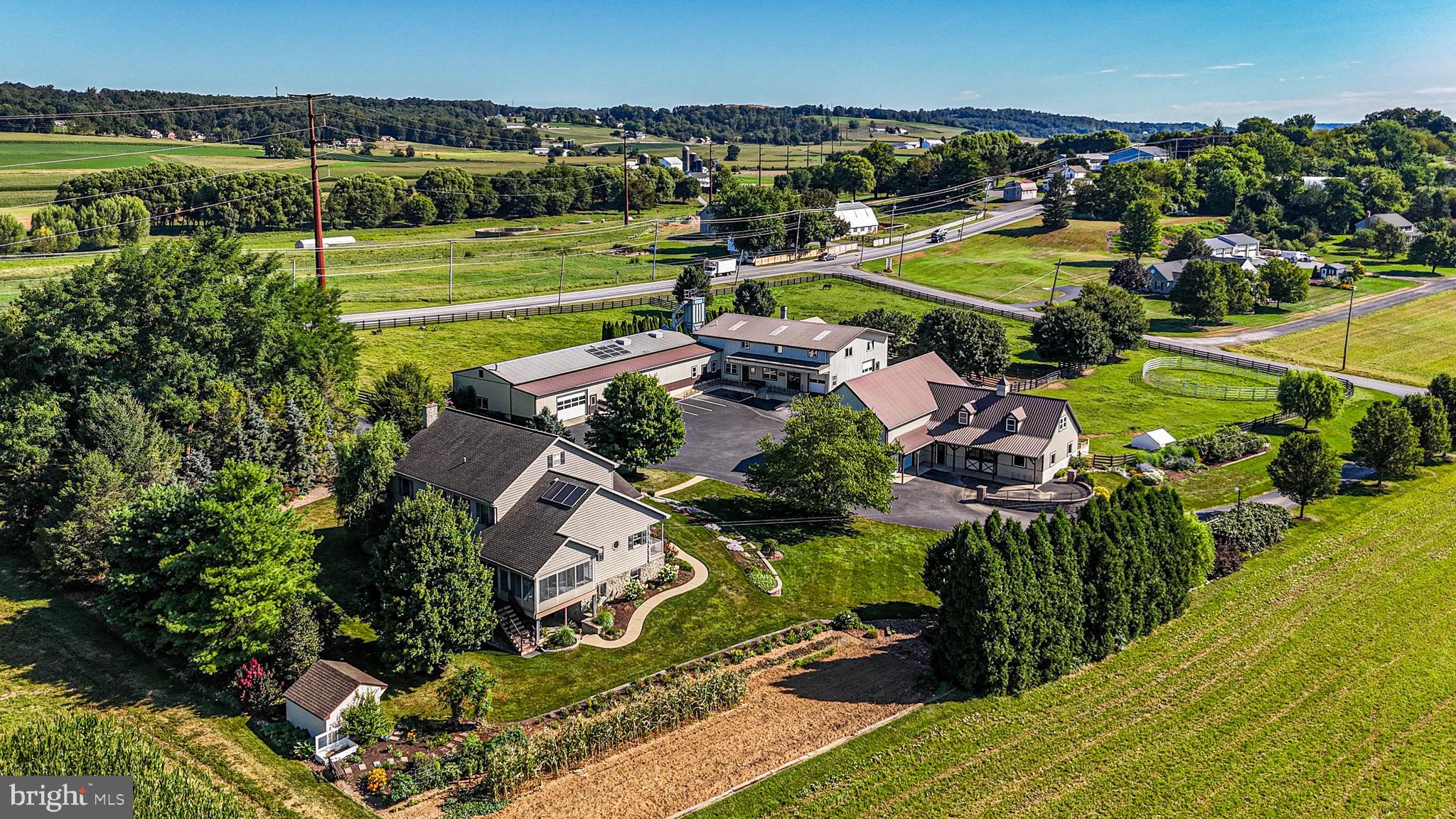 **This property will be offered at Public Auction on October 24, 2025 @ 5:00. The listing price is the suggested opening bid only and in no way reflects the final sales price. $65,000 Deposit due on auction date. 2% transfer tax to be paid by the purchaser. Settlement on or before January 2, 2026** Welcome to Maxwell Hill Road—a well-kept 5-bedroom, 2-bath  home offering serene country living. Beyond the charming interior and comfortable floor layout, this property shines with its exceptional array of outbuildings, making it a rare find for hobbyists, homesteaders, or anyone needing versatile workspace. The spacious detached garage, large multi-purpose workshop, and additional utility sheds provide ample room for equipment, tools, storage, or even a small business setup. Whether you're into woodworking, animal care, or just need extra space—this property delivers. Enjoy your morning coffee on the front porch and wind down on the back deck with views of your own usable, open lot. With a paved driveway and peaceful surroundings, this is a move-in-ready home with true potential.