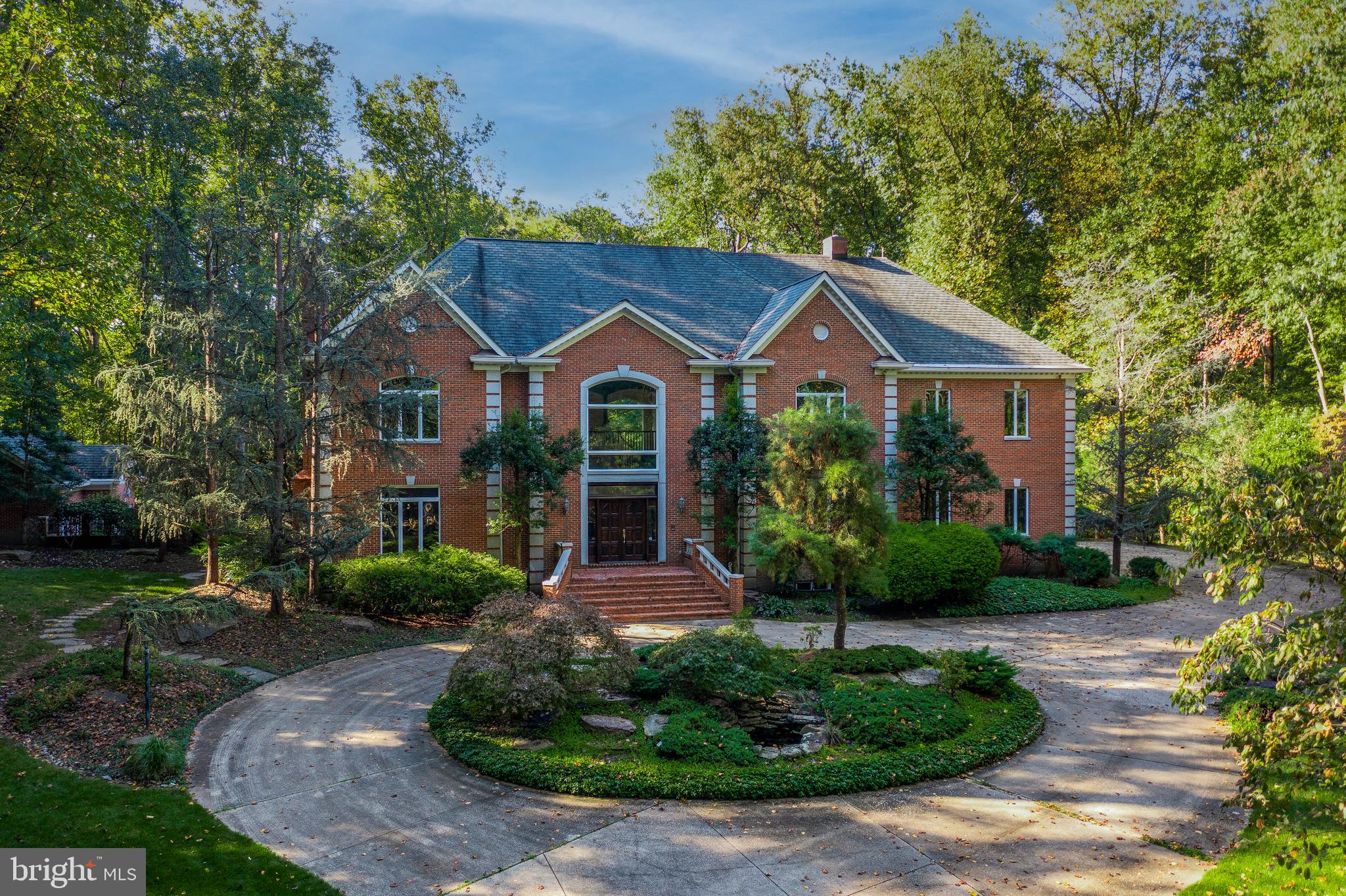Situated just half a mile from the acclaimed Bretton Woods Golf Course and Country Club, with a
prestigious River Road address, this secluded estate backs to a 630 acre Potomac riverside preserve. Including the pool house, the home delivers 7 bedrooms, 7 full baths, and 3 half baths, plus a jacuzzi room, 5 garage spaces -- and 3 kitchens.  
A peak of the river teases the imagination through the Wintertime trees. Immerse yourself in the absolute
privacy of this serene estate, with lush green surroundings punctuated by bursts of color in the spring.
Enter through the gates down a long private driveway, leading to the grand entrance with dazzling
granite staircases, and into this Embassy-sized home for entertaining in extravagant style. Whether you
crave peace and privacy for your family, or to entertain , this stately home provides that, enveloped in the sights and sounds of nature’s splendor. This custom beauty has just been upgraded with a gorgeous new kitchen and primary bathroom suite, featuring waterfall quartz counters and stunning finishes.  

An exquisite Schonbek crystal chandelier (motorized) is sure to be noticed by all your guests upon entering the foyer, which ushers into a stunning family room with 2 story ceilings, wood burning fireplace, and floor to ceiling French doors providing verdant views across the expansive deck that frames the rear of the home. From there, the expansive pool with heated spa and the independent 2-story guest cottage/pool house with kitchen are visible. So many living spaces on the main level: banquet sized dining room, butlers’ pantry, breakfast area off the open kitchen, formal living room with fireplace, and an elegant library/home office with custom millwork. 10 foot ceilings throughout. Upstairs, a magnificent primary bedroom suite with a propane fireplace, stunning new ensuite bath with sculpted tub and spa-sized shower, with tree top views and privacy. Two expansive walk in closets. All of the other 4 spacious bedroom suites on the upper level  feature ensuite baths, with marble or granite vanities, and walk in closets. The laundry is on the upper level as everyone desires.

In the walk out lower level, natural light is brought in by 2 sets of French doors leading to a patio and the
expansive yard. The space features wood-burning fireplace, wet bar with mini-fridge, 400 bottle wine
cellar, a guest room with ensuite full bath, billiards area, 2nd kitchen for catering, large ballet studio or
home theater, exercise room, a half bath and a jacuzzi party tub room.

Crown moldings throughout, extensive ceiling medallions, a total of 3 Schonbeck chandeliers and so
much more attest to the quality workmanship in this once in a lifetime estate.

Contract previously fell apart due to buyer financing.  Come see it again now that we're active as of July 4th weekend.