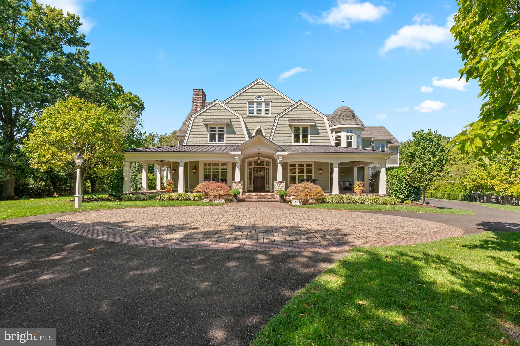 Welcome to 809 Brushtown Road, this residence redefines grandeur and elegance with exceptional craftsmanship throughout the home.  Set on an almost 3 acre lot of professionally landscaped grounds, this home spans more than 7,000 square feet of refined living, designed for both family life and world class entertaining, both inside and out!  This property is uniquely appointed with a newly constructed in law suite, above the oversized garage, with its own kitchen to ensure privacy and comfort for extended family and guests.  In total, this home boasts 6 bedrooms, 7 full bathrooms, and 1 half bathroom in the main home.  Enter through the private gated entrance, and you will immediately be drawn to the cobblestone driveway detail, the lush grounds, and this jewel box Colonial home with a distinctive shingled and exterior gambrel roofline, and a magnificent wrap around porch!  White oaks floors, soaring ceilings, and curated finishes set a timeless tone.  Step inside, and to the right of the grand foyer is a spectacular dining room with a coffered ceiling.  The gourmet chef's kitchen  is the heart of the home!  The kitchen includes an enormous marble island with seating for 7,  and the perimeter countertops are soapstone with a large soapstone sink.  The kitchen boasts custom cabinetry and range hood, and top of the line Sub Zero/Wolf appliances including a 48 inch dual fuel range with 2 ovens, 2 dishwashers, and a full 36" refrigerator and 36" freezer.  Adjacent to the kitchen is a Craft/Flex room offering endless possibilities for crafting, baking, holiday food preparation, a caterers workspace, etc!  This room offers yet another large center island, a refrigerator, an oven, a double faucet sink and soapstone countertops for all of your crafting or entertaining needs.  The kitchen flows directly into a sunlit breakfast room, overlooking the backyard and outdoor living spaces.  Enjoy the ease of open living with a natural flow into the cozy family room, ideal for everyday comfort and entertaining.  The main floor is further elevated by a study, highlighted by custom wooden beams, and a gas fireplace, creating a warm and inviting retreat.  This room includes a spiral staircase taking you down the incredible lower level!  The main floor also features a sunroom, with a custom built in wet bar with 2 SubZero beverage refrigerators.  The main level is thoughtfully designed for everyday living, complete with a full bathroom, powder room, pantry and mudroom that combine both convenience and comfort.  The incredible attention to detail continues as you ascend to the upper levels.  The primary suite exudes elegance with its coffered ceiling, and a private office, a fireplace, an outdoor covered deck and a thoughtfully designed coffee bar.   The luxurious primary ensuite features his and her bathrooms, offering a spa-like retreat.  Some of the features include, marble countertops, a custom shared marble shower, marble floor and air jet freestanding soaking tub. The primary suite also features his and hers walk-in closets, providing abundant storage.  The 2nd floor includes 4 additional bedrooms and 3 full bathrooms.  The 3rd floor also hosts its own bedroom and full bathroom, perfect for guests. The laundry room is located on the 2nd floor.  The lower level is the ultimate family recreation space recently customized with a theatre room, a gym, various living areas to host various games, an infrared sauna, a wet bar and full bathroom.  Almost as expansive as the home, the oversized garage offers room for 8 vehicles - an incredible space you have to see to believe!  The outside features an outdoor living and dining area that overlooks the sun kissed pool with a slide - perfect for family fun and entertaining! 809 Brushtown Road is situated in the top rated Wissahickon School District, and close to top private schools, clubs, shopping, dining, the regional rail, and major highways.  This haven is more than just a home - it's a lifestyle!