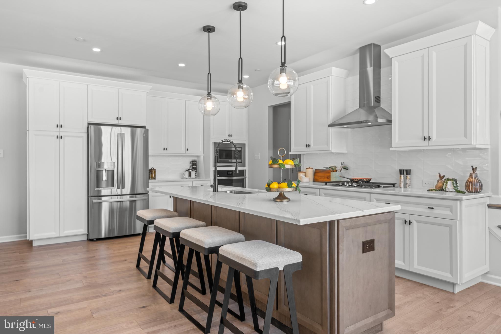 BRAND NEW HOME is Available at Copperleaf Ridge!  This popular Sutton Grand floorplan with a Finished Basement  is ready for your June move! Enjoy a protected view from the rear deck, nestled in a peaceful natural setting, within minutes from the amenities and charm of Kennett Square.  Not to be missed for location, livability, style and comfort, Kennett Square’s one-of-a-kind Luxury Townhome Community is proudly presented by Rouse Chamberlin Homes, a trusted Chester County builder for over 45 years.  11 Tullow Hill Drive shares some of the many designer selections with our model home, though some photos show decorative items that are not available.  Tour and compare 11 Tullow Hill Drive to the Model Home Today!   Included luxury finishes boast first floor 9 foot ceilings, impressive kitchen islands, and primary bedroom suites with spacious walk-in closets and elegant ceramic tile baths. This Sutton Grand floorplan showcases a welcoming foyer entry, opening to an inviting living space, connected to our Gourmet Kitchen Layout with stainless appliances and a large central island topped with  exquisite quartz for everyday gathering. The dining area includes a cheery glass slider with transom window above that opens to a low maintenance deck over looking preserved Chester County Greenway.  This Sutton Grand emphasizes an elegant primary bedroom suite boasting a breath-taking walk-in closet, dramatic tray ceiling  and sumptuous ceramic tile bath. A convenient second floor laundry plus spacious secondary bedrooms with large closets and shared bath complete the second level.  At Copperleaf Ridge you’ll enjoy a low maintenance lifestyle where groundskeeping and snow removal are provided. Easily accessible to Philadelphia and Wilmington from Route 41, the community is located in a prime location just minutes from major shopping and attractions like Longwood Gardens and Historic Kennett Square where fine dining, artist venues, and yearly festivals create a vibrant quality of life. Listing photos show very similar  decorated model with decorative options not included. Tour Copperleaf Ridge Thursday to Monday 11am to 5pm. Closed Tuesday and Wednesday.