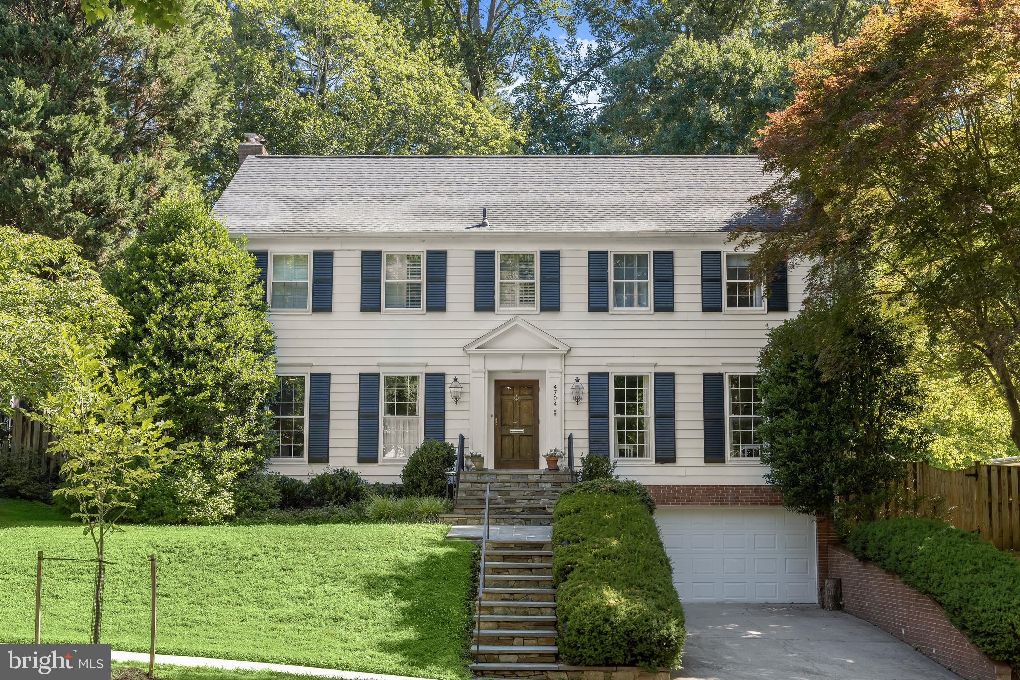 Beautifully updated and meticulously maintained Colonial offering generous living spaces, abundant natural light, and timeless architectural details throughout. A gracious entry foyer welcomes you into the home, where gleaming oak hardwood floors flow seamlessly throughout the main and upper levels. The gourmet kitchen features granite countertops, stainless steel appliances, and a sun-drenched breakfast area surrounded by windows overlooking the private backyard.

The spacious floor plan includes an impressive home office, oversized formal and casual living spaces, and exceptionally large bedrooms with ample closet space. The finished lower level provides additional recreation space, a wine cellar, and a cozy second fireplace.

Two sets of French doors open to a beautiful flagstone patio and expansive, professionally landscaped backyard, creating the perfect setting for entertaining, play, or quiet outdoor enjoyment. Ideally situated on a private lot, this exceptional home offers the perfect combination of elegance, comfort, and functionality.