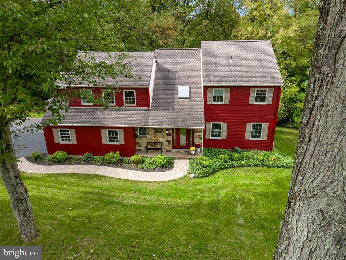 Truly exceptional contemporary farmhouse nestled on a lushly landscaped lot complimented by extensive hardscaping and backing to dense woods for lots of privacy in the picturesque borough of Chester Heights,  Delaware County, in the exclusive enclave of The Highlands; a community of 42 upscale homes on 1 acre plus lots and situated in the Garnet Valley school system, one of the best districts in Southeastern Pennsylvania with modern facilities, excellent curricula and extra curricular programs (including some of the best high school sports teams in the state), and is within easy traveling distance to the cities of Philadelphia and Wilmington (DE), and Atlantic Ocean beaches, Pocono Mountains, the Chesapeake Bay, commuting routes to all corporate centers, shopping, and the countless family amenities the area has to offer including parks, playgrounds, the Garnet Valley school campus, Brandywine Youth Club practice fields, dance studios, gymnastics studios, arts centers, and more.  This peaceful enclave has only one way in -and-out with no through traffic. Over the past three years, this fantastic home has been remodeled from top to bottom, inside and out, using the finest grade materials and is move in ready.  This lovely home is full of charm and character from its freshly landscaped front & rear yard with pachysandra beds, spectacular stone steps leading to the lower patio with a fire pit in the backyard, a new rustic paver walk meandering past a freshly painted barn red Facade, to the rustic stone paver porch and leaded glass main entry that walks into a breathtaking two-story foyer with a skylight, turned staircase, new chandelier, and new Australian Cypress hardwood flooring throughout the entire home. Adjacent to the main entry foyer to the right is a formal living room that is open to the formal dining room with its lovely bay window and seat looking out over the beautiful backyard  and is conveniently situated next to  an exquisite chefs kitchen that was completely remodeled in 2023 including glass front soft close cabinetry, center island & pantry, custom epoxy counter tops and back splash, stainless steel farmhouse sink, a complete suite of new stainless appliances, a sunny breakfast room and is open to the family room with its 13' vaulted ceiling and skylights for lots of natural light, lovely gas fireplace flanked by a stone accent wall and glass sliders that walk out to a large deck overlooking the private backyard and woods.  The first floor also features a convenient powder room and  newly renovated laundry room with new cabinets, custom epoxy counter tops and backsplash, a new full sized stacked washer & dryer and a built in clothes drying rack. For added convenience there is inside access to the oversized two car garage with a decorative epoxy floor, new garage doors and door openers.   On the upper level of this fantastic home is a luxurious & spacious master suite with a lots of closet space, a spectacular custom tiled en-suite master bath with a skylight, Viking style soaking tub, oversized tile shower with dual shower heads, double vanity and a private water closet. There are 3 additional spacious bedrooms with spacious closets, and an updated hall bath with double vanity, tiled shower and a free standing Viking style tub.   The finished walk out daylight basement  features a large great room / game room with built in storage cabinets and comes with a pool table & foosball table, a workshop with a custom epoxy floor, and there is also a utility / storage room that has a custom epoxy floor, additional shelving, an extra refrigerator/freezer, wash tub, and walks out to the paver patio / storage area under the deck and to the lovely backyard.  This fabulous home is a must see for the family looking for that special turn-key home  with nothing to do but move right in and enjoy every amenity this fantastic home and community have to offer.  Schedule an appointment to see this home today before its too late !!