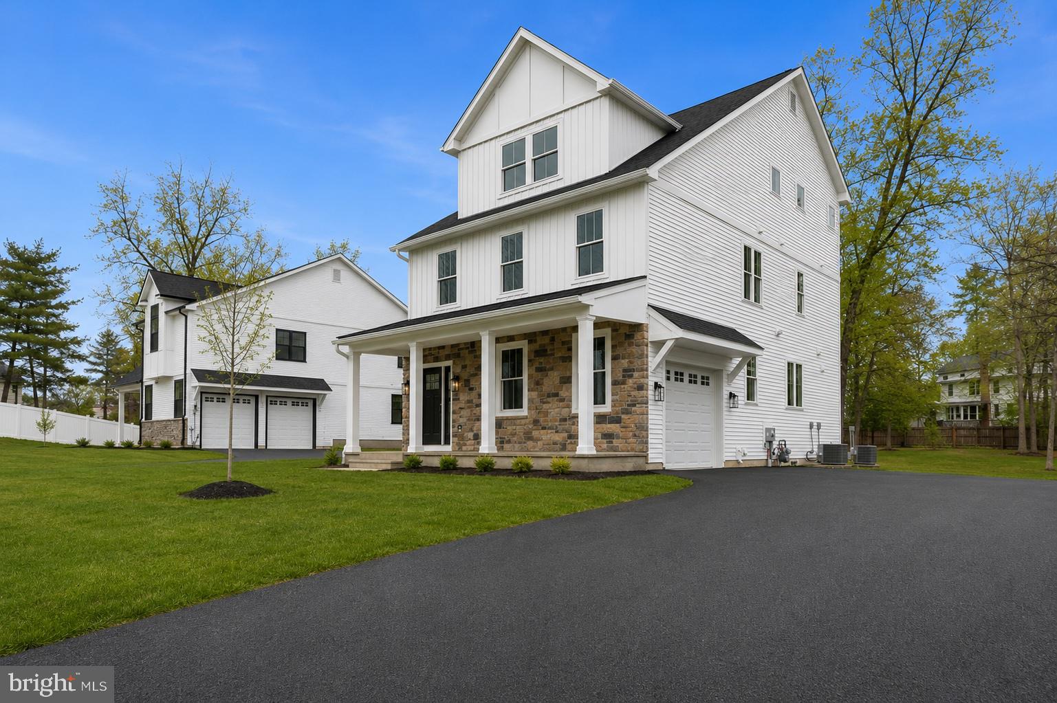 14 Churchville Lane is one of just three custom-built modern farmhouse residences in the Churchville Pointe enclave, offering newly constructed living space across three finished levels within the highly regarded Council Rock School District. The home includes 5 bedrooms, 4.5 bathrooms, and an oversized interior garage, combining contemporary finishes with a thoughtful layout designed for comfortable everyday living.

Interior features include wide-plank white oak flooring, recessed lighting throughout, Cat-6 wiring for high-speed internet and sound, and pre-wiring for ceiling fans in multiple rooms. The open living spaces are anchored by a gas fireplace and connect seamlessly to the kitchen, which features white cabinetry, white countertops, stainless steel appliances including a wine refrigerator, and a full-height backsplash that extends to the ceiling behind the range. The center island includes a dining overhang with contemporary wood accent detailing, creating both a practical gathering space and a strong visual focal point.

The home’s three-level bedroom layout provides excellent separation and flexibility, with the primary suite located on the second floor and three additional bedrooms positioned on the third level, creating a sense of privacy and spaciousness rarely found in new construction.

Additional living space is provided by the daylight walk-up lower level with high ceilings, a full bathroom, and exterior stair access, offering flexibility for recreation, guests, fitness, or media use. Outdoor living includes a large elevated Trex deck, while the home also offers quality construction and modern systems throughout.

Located just minutes from Richboro, Newtown, and New Hope, the property offers convenient access to shopping, dining, and commuting routes while maintaining the quiet character that makes Churchville one of Bucks County’s most desirable settings.  Builder is offering financing incentives through preferred lender which may include below market interest rates for qualified buyers.