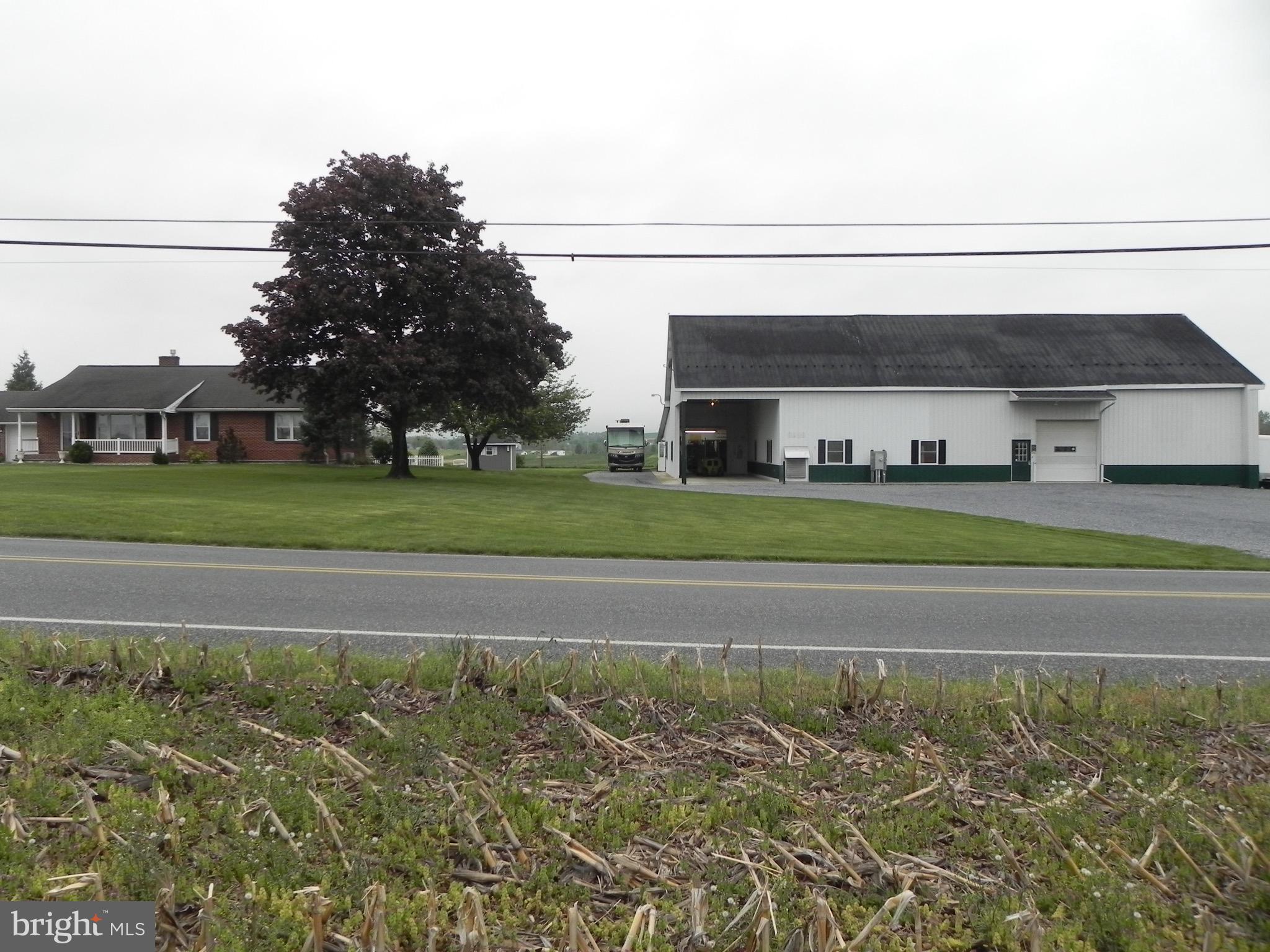 Please Note: This property sells at Public Auction. The listed price is NOT the sale price but is considered a fair starting bid.  Franklin County, PA.  REAL ESTATE AUCTION   Tue. July 14, 2026 @ 6:00 PM, 3669 Parnell Dr. Mercersburg, PA. 17236.  From Rt. 30, take Rt. 416 South 2.7 mi. Turn Left On Parnell Drive.  Excellent Condition!  /  Approx 47 Acres of Farmland!  Parcel #A - House & Shop On 1.93 Acres.  DWELLING: Beautiful Brick Rancher w/ 2 Car Garage attached w/loft storage. 3 bedrooms, 1 1/2 baths, Nice maple custom kitchen, new in 2014 w/ Kitchen Aid brand appliances. Dining area w/ lighted curio cabinets, bar sink, & corner desk. Large living room w/ native limestone gas fireplace & walnut built-in bookcase. Oak hardwood flooring. Basement: Mostly finished w/ exercise room, laundry, & office area.  Lots of basement & attic storage area. Heat is oil hot water baseboard. Central Air.  Large paver stone patio w/ fire pit & propane outlet. Beautiful landscape!  House is approx. 1,848 sq. ft.  10' x 10' GARDEN SHED, Private sewer / Private & Public Water / Blacktop Drive. SHOP: (Recently occupied by Parnell Cabinet Shop). Approx. 6,800 sq. ft. 13' ceiling, 2-10' x 10' overhead doors, half height dock, large work area, finish room w/ compliant lighting, 2- show rooms, office, restroom. Large loft storage area. Well insulated. Heat is hot water coal furnace. 80 hp. capacity phase converter.   Parcel #B - Approx 47 Acres m/l Limestone Farmland.  Adjacent to Parcel #A.  All tillable, nice flat terrain. No improvements.  Approx. 2,475 ft. road frontage.  Franklin County / Peters Twp.- No Zoning. Tuscarora School District.  Auctioneer's Note: Buildings are in good condition w/modern updates. Surrounded by farmland. Enjoy majestic mountain view! You will like it!  Parcels will be offered jointly & separately. Terms: $30,000.00 deposit per parcel @ auction. Balance within 60 days.  Open Houses: Thur. June 4, 5-7 PM & Sat. June 13, 1-3 PM or by appointment.  Attorney: Hoskinson, Wenger, & Rife.**THIS LISTING SHOWS TAX INFORMATION FOR PARCEL A ONLY WITH HOUSE/SHOP/1.93 ACRES (TAX ID# 18-0K18.-068.-000000). SEE LISTING# PAFL2035324 FOR TAX INFORMATION ON PARCEL B WHICH IS APPROX 47 ACRES WITH NO STRUCTURES.**