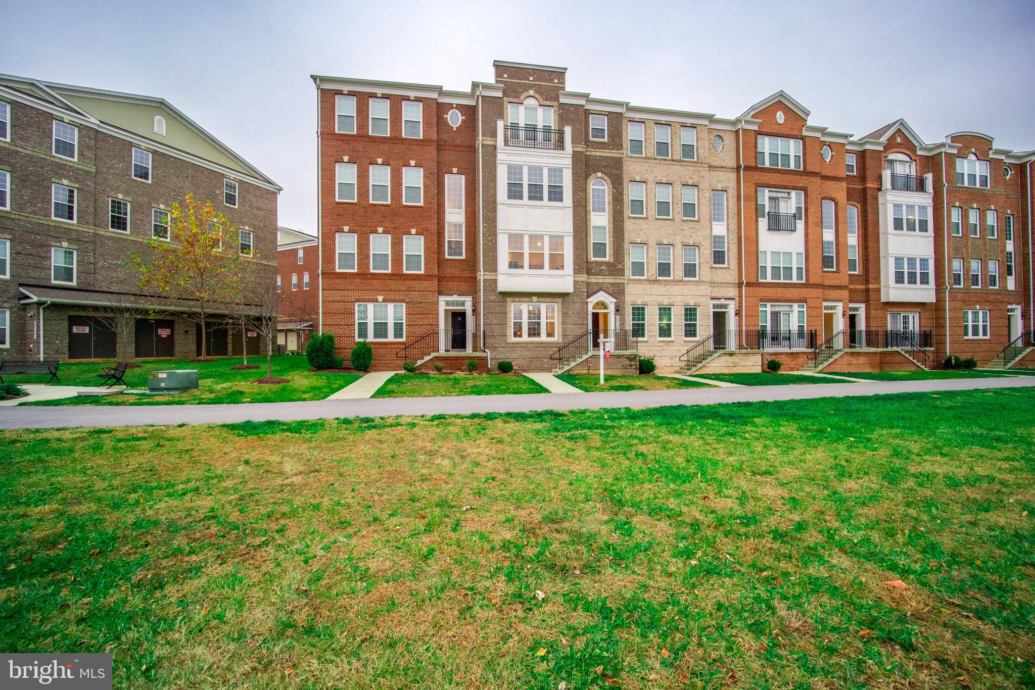**** Fresh Price Improvement****. Highly motivated seller!  Over $7000 Reduction.  
SAVE ON FUEL. This property is located just off the I270 corridor, 23 miles outside of Washington, DC. This fully upgraded, meticulously maintained residence in coveted Century Row, offers the luxury and convenience of urban living, all within walking or short driving distance to lively town centers, casual and fine dining hotspots, transit, vibrant shopping, unlimited recreation, and cultural and entertainment venues. Black Rock Arts Center, Topgolf, Black Hill Regional Park and more.

The attractive, brick-front exterior with covered entryway elevates the curb appeal of this 2-story townhome-style condo. Enter the interior's open concept design indulging the senses with abundant natural light, 9 ft. ceilings, recessed illumination, main-level luxury vinyl plank flooring, and neutral-color upgraded plush carpeting on the railed staircase and throughout the upper-level. The first floor is ideal for intimate gatherings, showcasing a rear kitchen with upgraded stainless-steel appliances and sink, 42" cabinets, 5-burner full range, large galley island with bar seating; convenient powder room, large guest/storage closet and backdoor access to the private garage.

Enjoy the comfort of a spacious upper level, featuring (2) sizable secondary bedrooms with ample closet space and heightened views; a primary suite sanctuary with architectural bump out for bonus space and deep box windows; an ensuite signature bath with gorgeous custom tiling and granite countertops, grand frameless glass in-seat shower, plentiful cabinetry/linen storage, and a super-sized walk-in closet with built-in shelving. A beautifully upgraded second bath with tub, enclosed laundry area with full-sized washer/dryer and shelving, plus utility room complete this floor.

This Smart home features junction boxes throughout, security system with motion detectors, integrated fire protection system (detectors & sprinklers), NEST temperature control, remote garage door control and keypad entry, remote carbon monoxide detection, and in-wall pest control port.

Come home to exceptional community amenities that make a difference including pocket playgrounds, walking and fitness trails, plus top-rated healthcare facilities and MoCo schools.