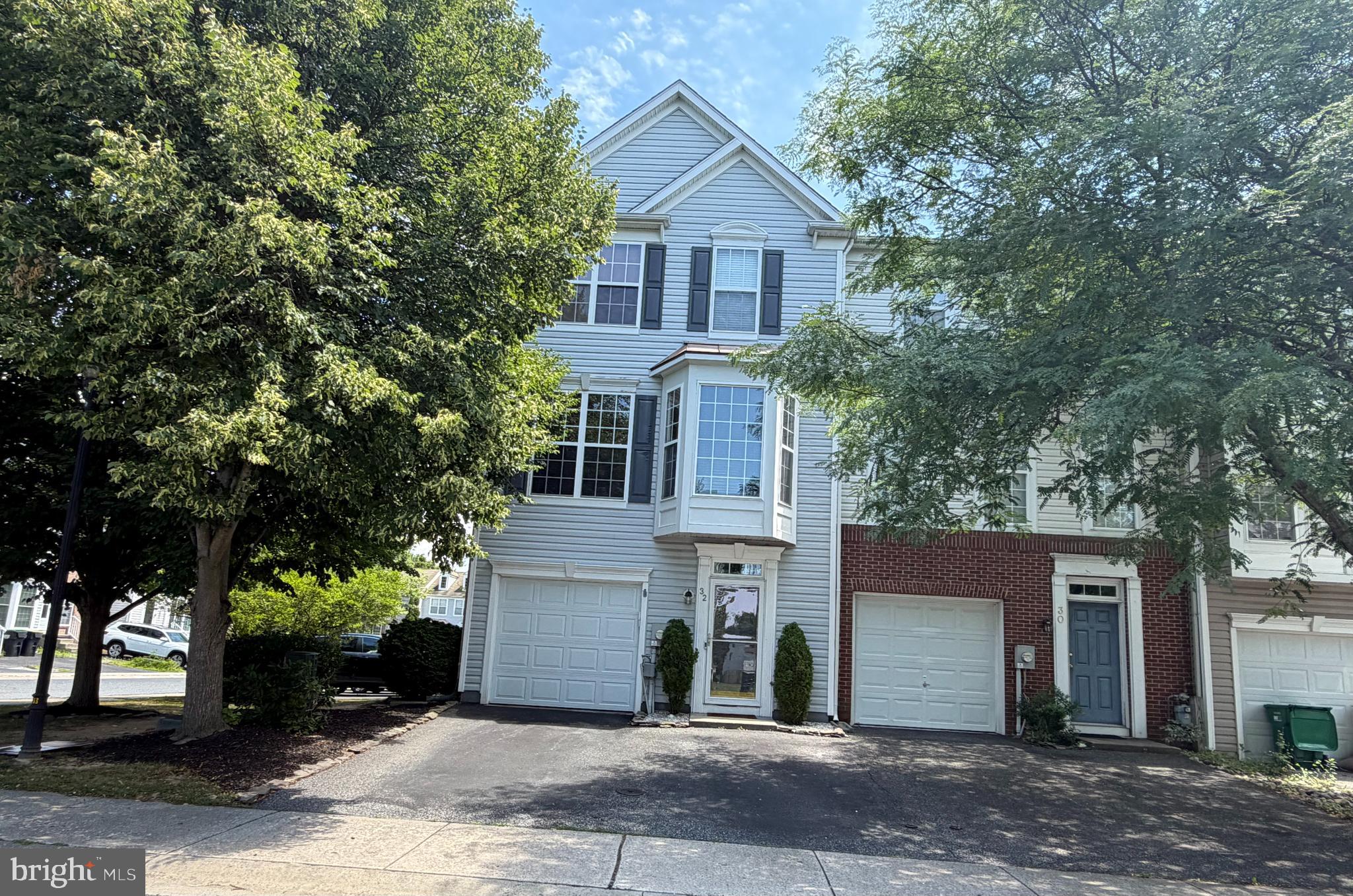 Welcome to 32 Glennwood Drive, a spacious 3-bedroom, 2.5-bath end-unit townhome in Glennwood Station in Newark, DE. Set on a corner lot, this home offers added outdoor space, a fenced rear yard, and a one-car garage.

The main living level features 9-foot ceilings, hardwood floors, recessed lighting, crown molding, chair rail, wainscoting, and two bay windows that bring in natural light. The large eat-in kitchen offers upgraded cabinetry, quartzite countertops, a center island, pantry, gas cooking, and hardwood flooring.

Upstairs, the primary suite includes a vaulted ceiling and a private bath with a soaking tub and separate stall shower. The laundry area is located on the bedroom level for added convenience. The lower-level family room provides flexible living space and features sliding doors that open to the fenced backyard.

Additional highlights include a newer roof, updated HVAC, and a convenient location near shopping, dining, major routes, and everyday services. With generous room sizes, thoughtful upgrades, and an end-unit setting, this home offers comfort, function, and convenience. Schedule your showing today.

Property is located within 5 miles of Newark Charter School!

All information is deemed reliable but not guaranteed and should be verified by buyer and buyer’s agent.