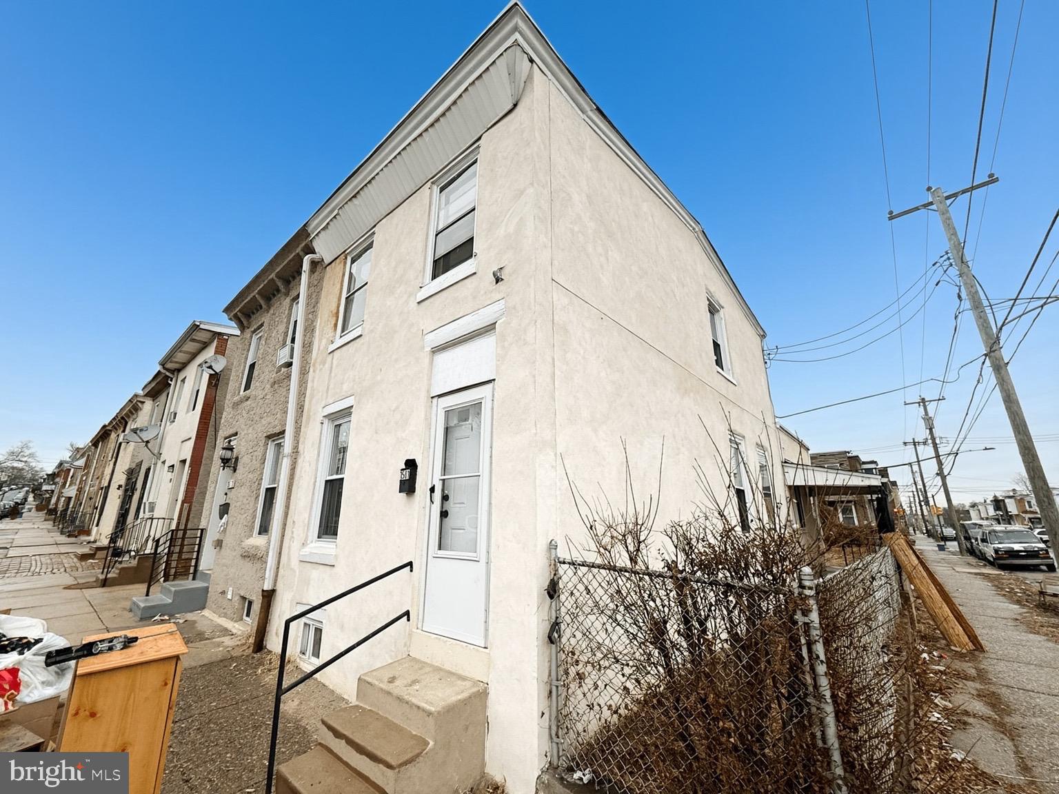 Set in Philadelphia’s Carroll Park neighborhood, 1501 N Redfield St offers a smart, low-maintenance layout with hard-surface flooring throughout. The main level flows from the living room into a spacious dining area featuring charming built-in cabinets and shelving, then back to the kitchen with stainless steel appliances and convenient in-unit washer and dryer. Two bedrooms and a full bath are upstairs, with ceiling fans throughout for added comfort. Enjoy multiple outdoor spaces including the side porch, fenced side yard with a side entrance, and a rear yard for grilling, gardening, or relaxing. Natural gas forced-air heat. Close to transit and everyday essentials, this end unit works well as a move-in ready home or a straightforward investment option.