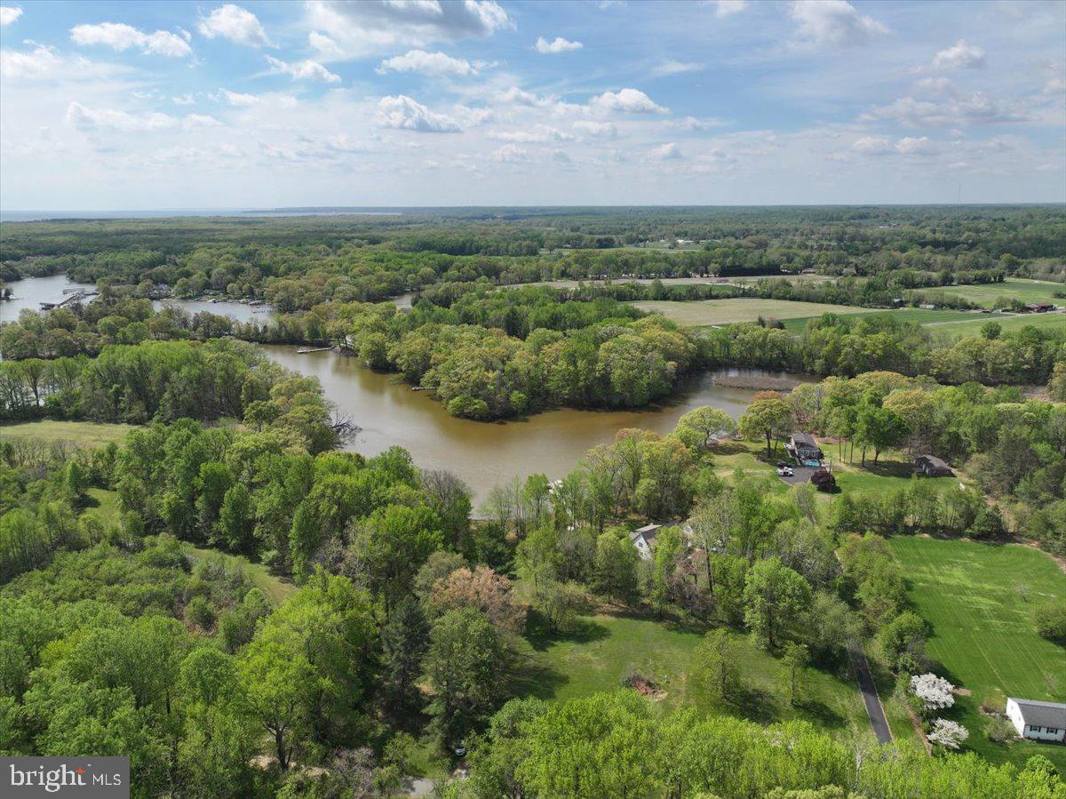Just Reduced....and Ready for Final Permits!  Pristine Waterfront Canvas: 2.82 Buildable Acres on Smith Creek.
Rare opportunity to acquire a completely vacant, buildable waterfront lot which is ready for permit in the heart of West River. The legwork has already been done - the permit process is almost complete, just pending the Buffer Management Bond.   Previously approved plans for a 5000+ sq.ft home are available for purchase,  or design your own  homestead on this sprawling 2.82-acre parcel which offers the perfect blend of wooded privacy and 80 feet of premium water frontage on Smith Creek. Skip the headache of demolition or renovation, this is a clean slate ready for your custom architectural masterpiece.  Direct navigable access to the West River and Chesapeake Bay makes this a boater’s dream.  Escape the city to your own private sanctuary just 15 minutes from Annapolis, around the corner from Galesville, and an easy commute to DC and Baltimore. Boat to several waterfront restaurants & marinas located a quick ride away.