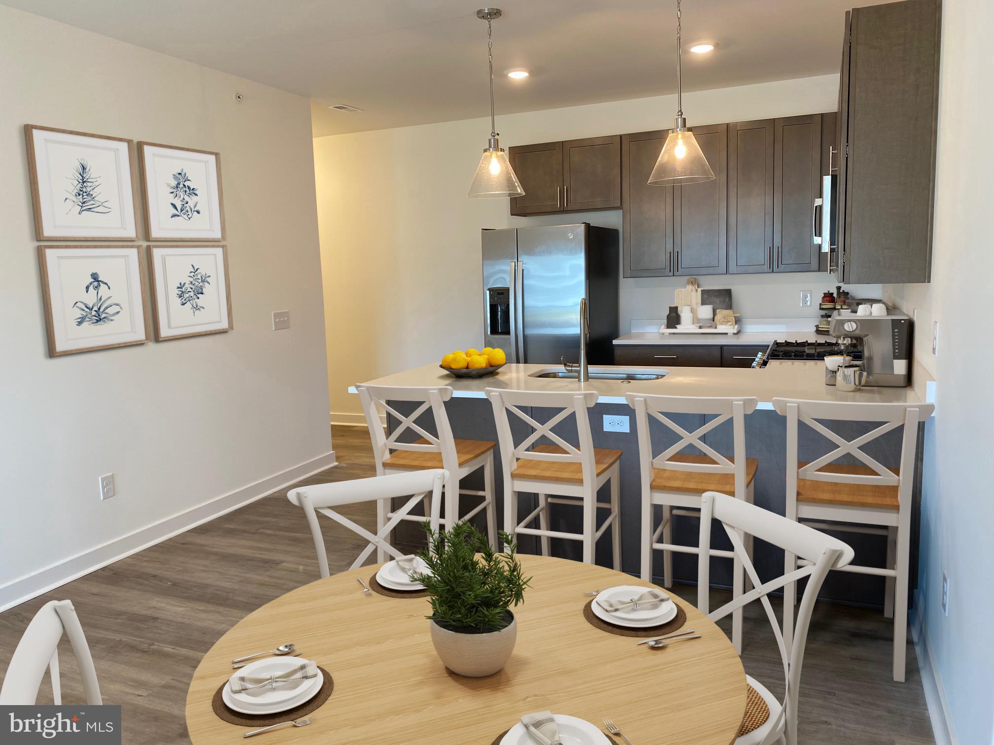 First Floor Admiral unit. Come explore the newest condominium project in Lewes, Delaware. Located off of John J. Williams Highway just 5.5 miles to Rehoboth beach and 9.6 miles to Cape Henlopen State Park.  Building A (final building) is complete and ready for occupancy. Project has a total of six buildings with 30 units. Community features pool and pool house and a gated entrance for security. One level living of  1397 square feet with nine foot ceilings, Granite countertops in kitchen and baths, stainless steel appliances, ceramic tile shower walls and natural gas. Unit has a large private balcony and  each building has a common elevator.   Sales center open Saturday and Sunday 10-2.