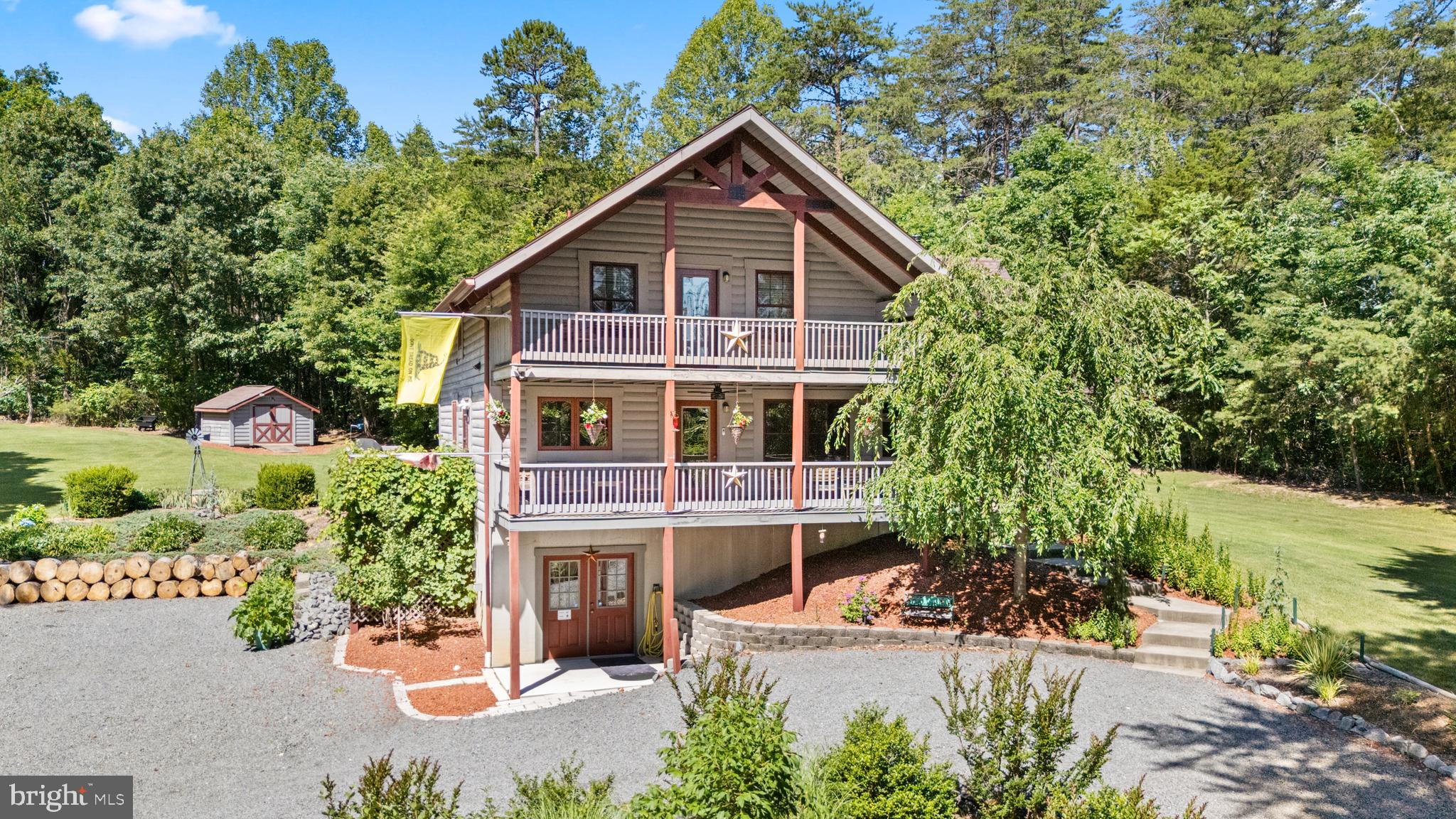 THIS INCREDIBLE LOG HOME HAS EVERYTHING!  IT'S A 4BR 3.5 BATH HOME WITH WIDE OPEN HIGH CEILINGS, HUGE FAMILY ROOMS, 3 LEVELS OF LIVING SPACE.  LOWER BR NTC.  YOUR FAMILY AND FRIENDS WILL BE CALLING YOU TO ASK IF THEY CAN COME VISIT FOR THE WEEKEND.  WHAT DO YOU WANT TO DO?  BOATING, SWIMMING, FISHING OR JUST ENJOYING THE BEAUTIFUL SURROUNDINGS AND LANDSCAPING OF THIS FABULOUS HOME.   THE LAKE LIFE IS A LIFESTYLE,  MANY WISHED THEY COULD HAVE.  DON'T MISS OUT ON THIS WELL MANAGED HOME  AND MAKE THIS LAKE ANNA EXPERIENCE YOUR OWN.   ASK ABOUT SEEING THE DEEDED SLIP AND THE NEWLY UPDATED DOCKS.  COULD THIS BE A GREAT AIR B AND B OR WHAT?
EVEN HAS A TESLA CHARGING STATION!
OWNER WILL NEED RENT BACK UNTIL AUGUST 15TH 2026*********