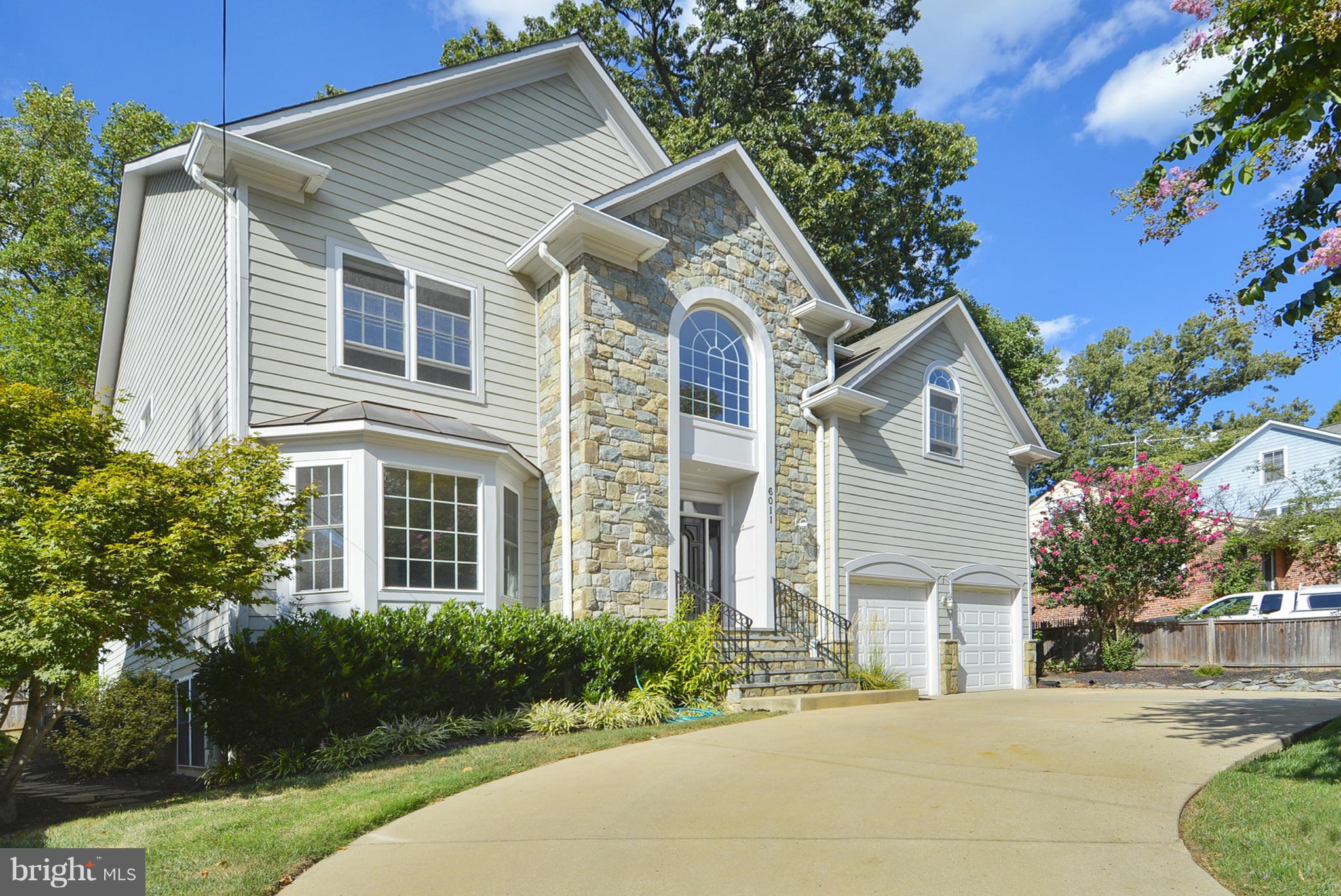 Gorgeous 5BR, 4.5BA stone front Colonial, innovative open flr plan, gourmet kit w/SS apps & grantite counters, tons of natural light. hrdwd flrs 1st & 2nd flrs, master suite w/his & hers WIC, spa BA, soaking tub & sep shwr. 3 additional BRs w/WICs. Rec Rm and Fitness Rm in finished lwr lvl w/5th BR w/WIC, Full BA & walk-up rear exit. Attchd 2 car garage & circ drvway, lrge bckyrd w/garden.