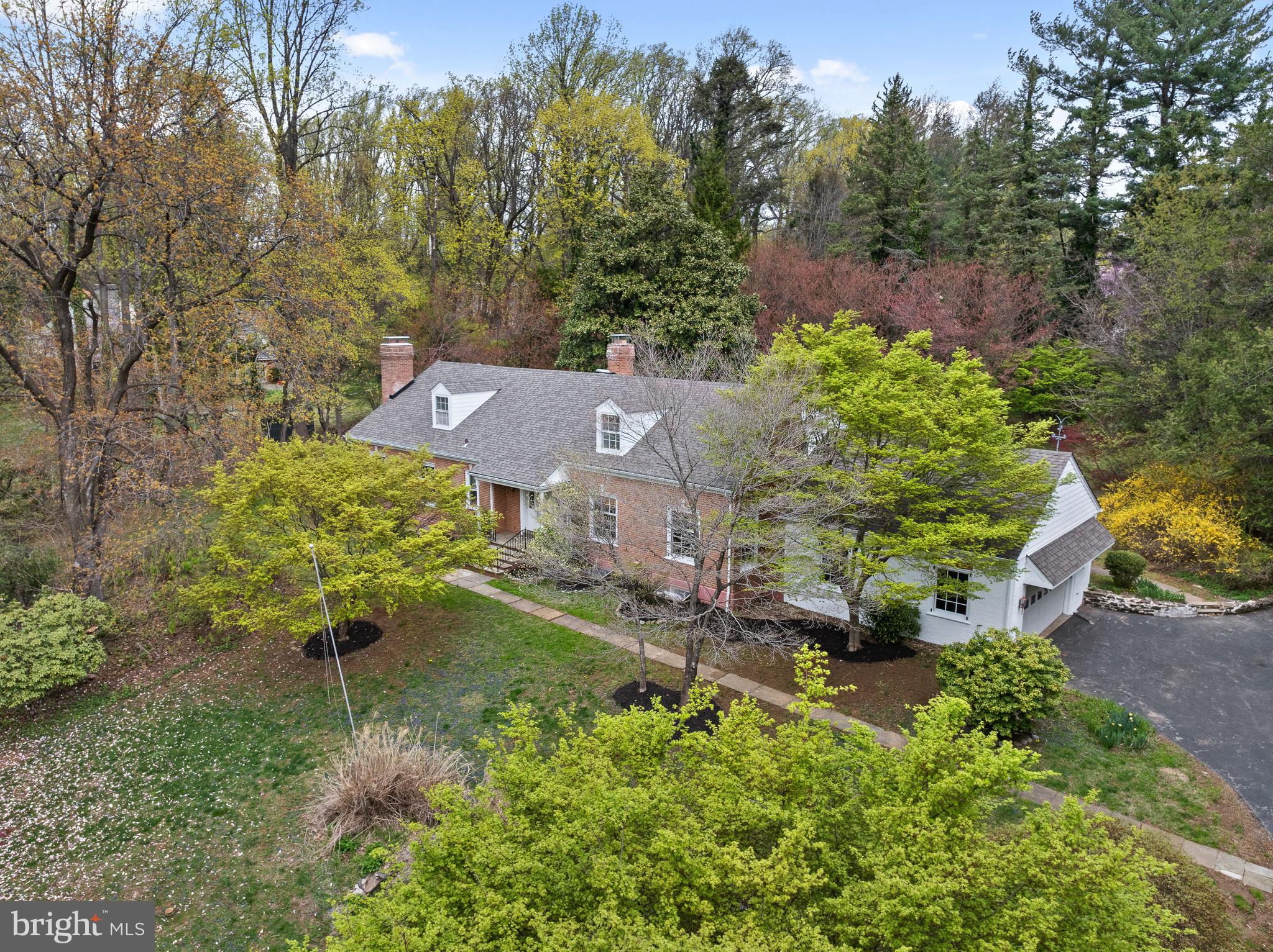 Beautiful Northside Bryn Mawr Cape Colonial set far back from the road and perched on 1.14 tranquil acres. A lush, private yard with mature trees and plantings allows for a private oasis or the perfect yard for entertaining.   This property is back on the market with notable exterior improvements including a brand new front roof, and shingles (2024), newly installed shingle siding, gutters, downspouts, soffit, flashing, trim, LED flood lighting and new porch columns (2025).    Situated in the highly desirable Lower Merion School district, this expansive home boasts over 4600 square feet (plus a finished basement), and is in a premier location just minutes away from everything the Main Line has to offer.  Walk up the path and enter the home into a gorgeous two story foyer.  The first floor offers an abundant amount of living space including a formal living room with a fireplace, a gracious dining room, and an updated kitchen with gas cooking, Corian countertops and custom cherry cabinets.  The kitchen and dining area flow into a sunny sky lighted sitting room addition with a powder room.  A large family room with another fireplace and ample built in shelving is directly off the kitchen.  The first floor includes the primary bedroom, and an adjacent full bathroom with a bidet, stall shower and whirlpool tub.  Also on the first floor is another large bedroom/study/office, a full bathroom and first floor laundry.  The second floor has 3 additional large bedrooms, and a full bathroom.  The basement is finished, and provides plenty of extra living space and storage area.  This home boasts gleaming hardwood floors throughout, 4 fireplaces, exposed brick and excellent flow!  Schedule your appointment today!
