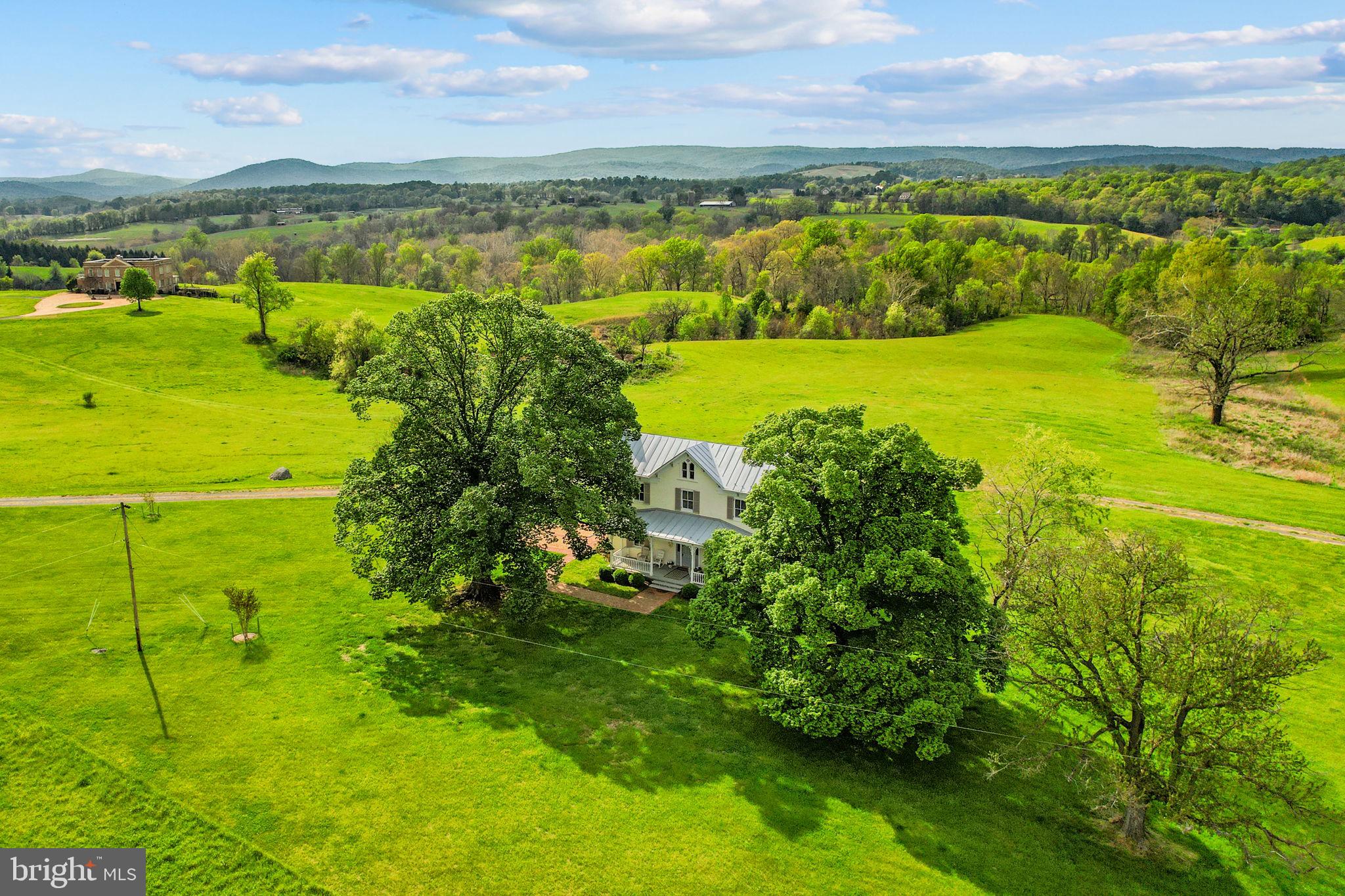 Set on 120 pristine acres in the heart of Virginia’s hunt country, this exquisitely restored 1860s Victorian farmhouse offers a rare opportunity to own a private estate with sweeping 360° Blue Ridge Mountain views. Overlooking Goose Creek and framed by spectacular sunsets, the property blends timeless elegance with modern comforts, featuring thoughtfully designed interiors, a spa-inspired bath, and inviting indoor-outdoor living with expansive porches and firepit entertaining areas.

Perfectly positioned just minutes from route 66, Upperville, Middleburg, and some of the region’s most prestigious wineries and equestrian events, this estate is ideally suited for the discerning buyer seeking both tranquility and proximity to the country’s premier horse community. With ample acreage for riding, recreation, or future equestrian pursuits, this is a truly exceptional offering in one of Virginia’s most coveted settings in Orange County Hunt territory.

Also available as 50 acres including the house, pending boundary line adjustment. Contact seller agent for more details. Agent related to seller.

Professional interior shots coming soon