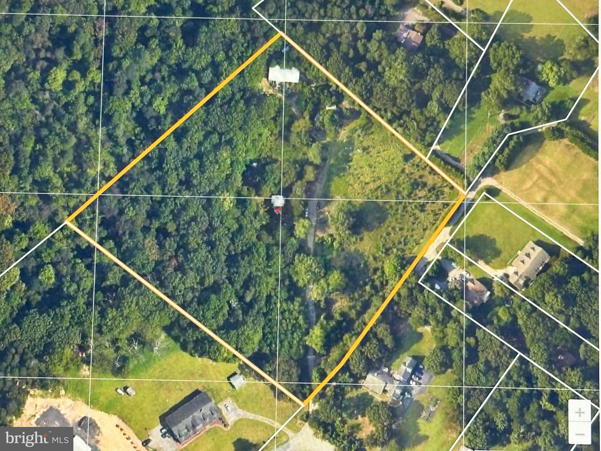 Opportunity Doesn't Wait. Neither Should You.
Acreage. Privacy &  Possibility.
Introducing a rare 7.22± acre offering in the heart of Anne Arundel County—where the true value isn't what's here today, but what you can create tomorrow.

Nestled among mature trees in a peaceful setting, this exceptional parcel presents the opportunity to build the custom estate you've envisioned, create a private retreat, or establish a possible home-based business location (subject to Anne Arundel County approval and zoning requirements).

No HOA. No restrictive covenants. Just the freedom to bring your vision to life.
An existing outbuilding provides a head start for storage, workshop space, equipment, or future project support, adding immediate utility as you plan your next chapter.

*The existing residence is condemned and conveys strictly as-is, with no contributory value assigned to the structure. The existing septic system is non-functional, and the property is being marketed strictly for its land value and exceptional homesite potential.

Ideally located with convenient access to Baltimore, Annapolis, Fort Meade, BWI Airport, and Washington, D.C., you'll enjoy the perfect balance of privacy, accessibility, and room to grow.
Whether your vision includes a custom-built home, expansive outdoor living, hobby space, or a private country retreat, opportunities like this are increasingly rare in Anne Arundel County.
Rare land. Unlimited potential. Your vision starts here.

Property conveys strictly as-is. Existing residence is condemned. Existing septic system is non-functional. Buyers are responsible for conducting all due diligence regarding demolition, rebuilding, utilities, permitting, zoning, home-based business approvals, and future intended use.