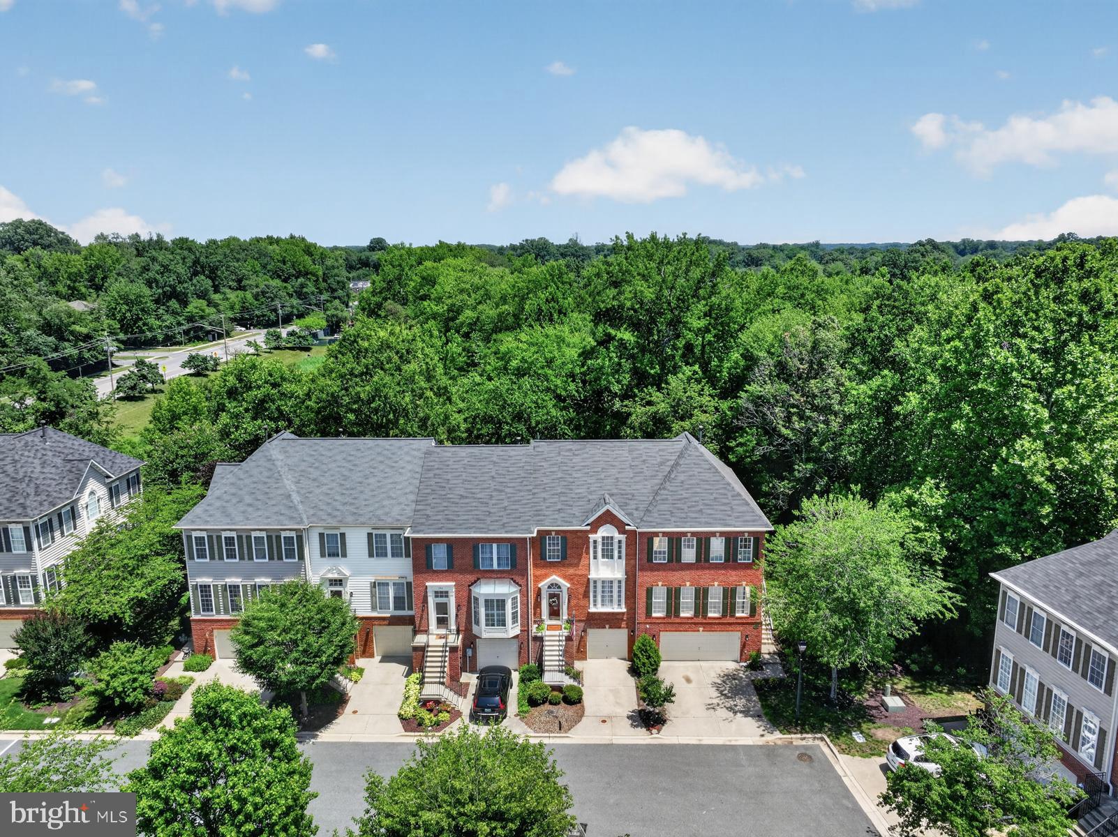 MOVE-IN READY Garage Townhome with almost 2500 sf of living space in the sought-after amenity-rich SOUTH RIVER COLONY neighborhood in Edgewater.  Featuring 3 Bedrooms, 2 Full Baths and 2 Half Baths, Solid Hardwood Flooring, lots of green space/pond view in the back of the home.  All 3 levels are finished with a 4' bump out.  Gleaming hardwood floors, open concept kitchen with large center island and granite countertops with recessed lighting.  Large Primary Bedroom with walk-in closet and vaulted ceilings.  Ensuite primary bath features a dual vanity, separate shower and soaking tub and lots of cabinetry.  Lower level is perfect for hosting your Superbowl parties with a spacious Recreation Room with cozy gas fireplace featuring marble surround and built-in bookcases.  Paver stone patio is located under the large deck that has a view of the community pond with walking trails.  Newer roof and freshly painted in most of the home.  New carpet.  South River Colony is a premier community in Edgewater featuring the award-winning South River Golf Course (call for membership information), 2 sets of Tennis/Pickleball Courts, Basketball Court, Tot Lot/Playgrounds, Picnic Areas, 2 Outdoor Swimming Pools.  Blue-Ribbon South River Schools.  Walkable to shopping, restaurants, post office and library.