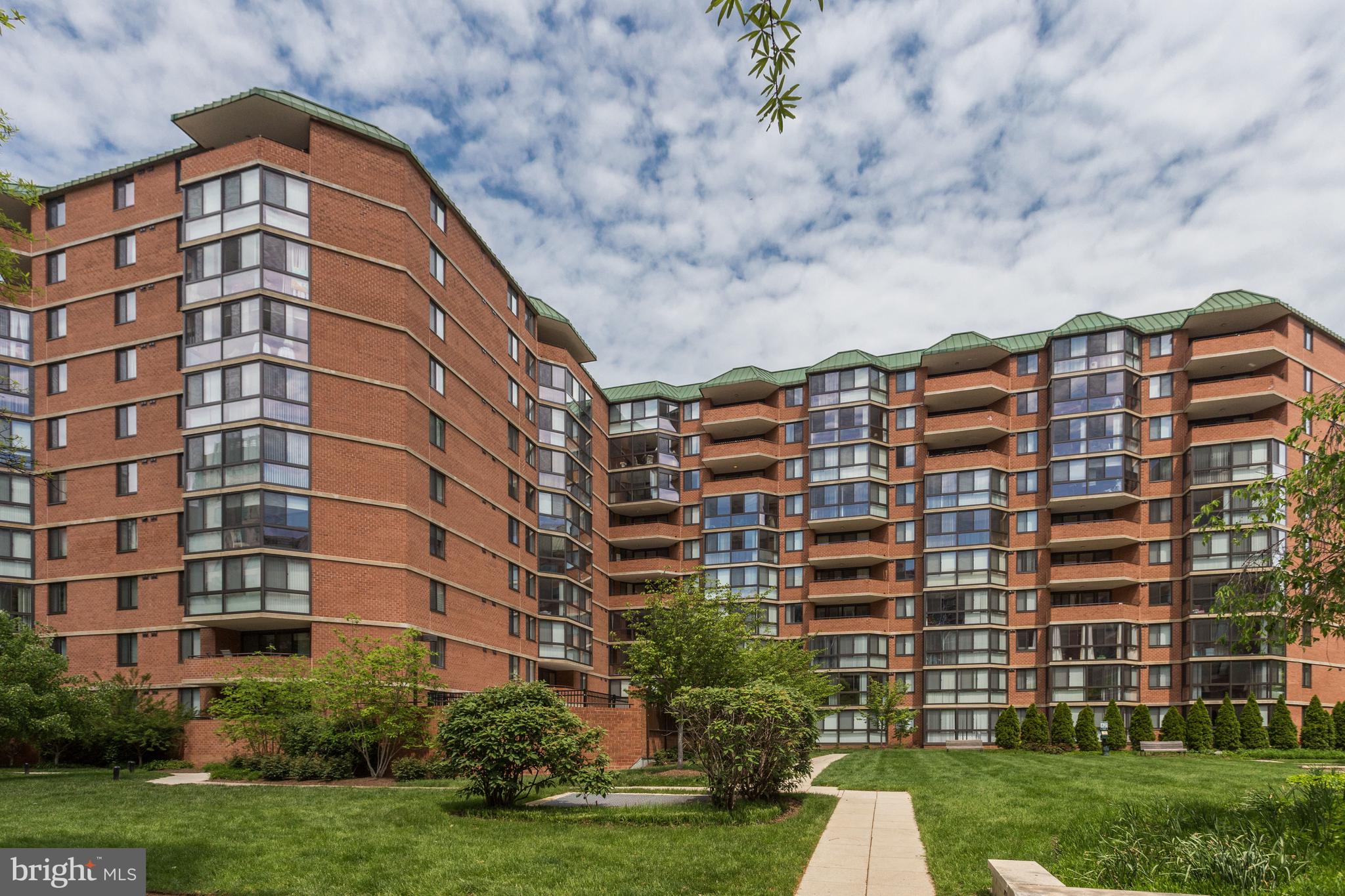 This top floor 1 Bed/1 Bath home in the heart of Vibrant Ballston has an estimated 737 Square Feet of living space, including a 100+ sq ft sunroom with panoramic views of leafy north Arlington, Quincy Park, and even the National Cathedral in DC. This bright and versatile space is perfect as an office or as an extension of your living area, and its beautiful floor to ceiling windows (replaced less than 2 years ago) showcase this unit’s unique views. 
The kitchen boasts granite countertops and stainless steel appliances, and the spacious bedroom features brand-new carpeting and a walk-in California Closet with custom shelving. An in-unit washer/dryer and an assigned parking space in the secure garage parking add to the convenience of this luxury condo unit. Recent paint and a New Hot Water Heater, make this fresh home truly ‘move-in ready’
Renovations throughout this convenient building include: The Fitness Center, Pool and Hot Tub (both in scheduled for summer completion), Common Areas, Cyber Cafe, and Outdoor Grilling and Pet Areas. The Condo Fee also includes water, trash and recycling removal. Enough cannot be said about the location, with its Walk Score of 94. Glorious Quincy Park and Playground, the shopping and Restaurants of Ballston Quarter and Ballston Exchange, as well as Ballston's Orange/Silver line Metro Stop are all right around the corner. Currently zoned for top schools Arlington Science Focus, Swanson Middle and Washington-Liberty High Schools.