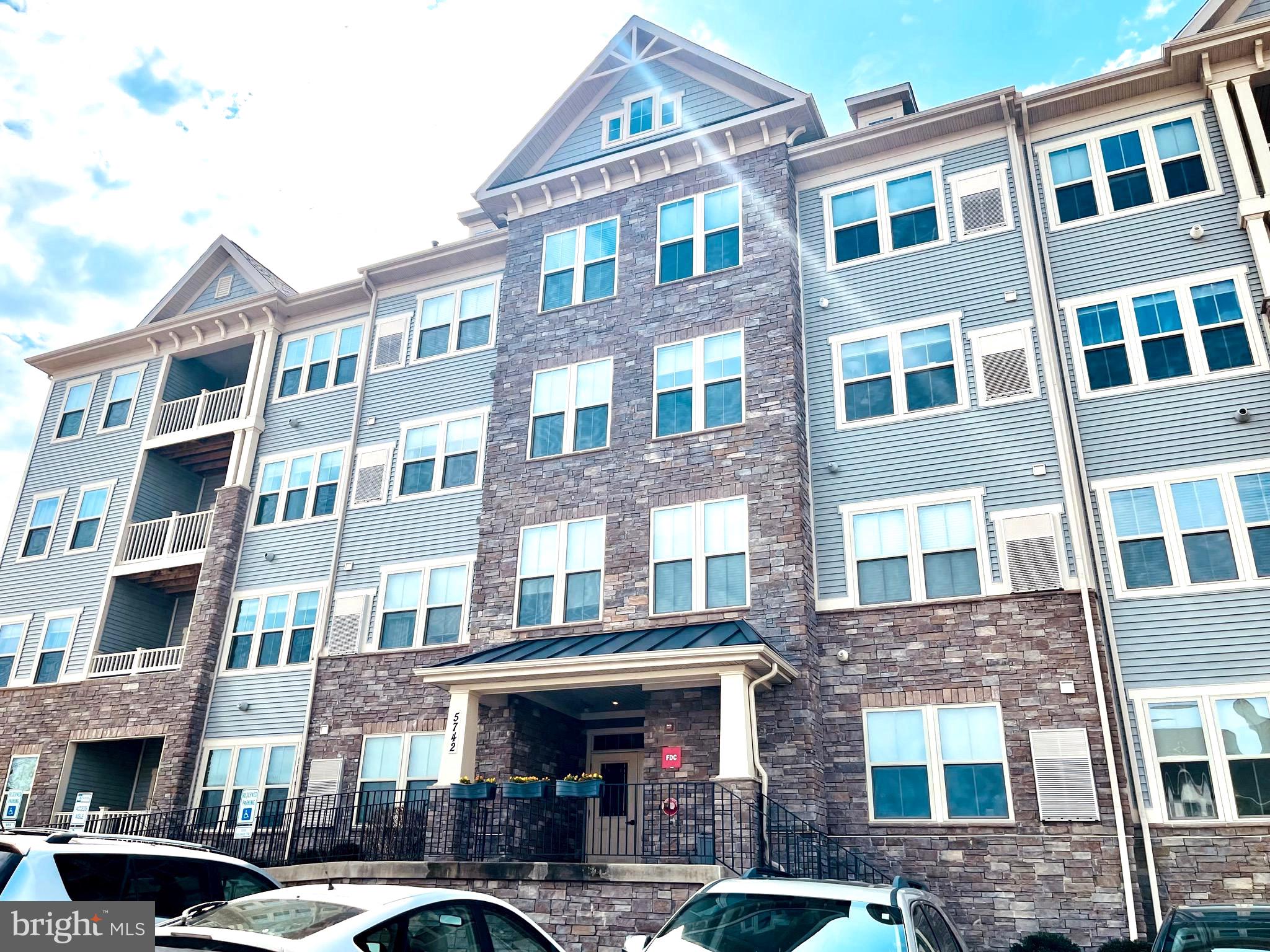 Welcome to this beautiful well maintained sun light filled spacious condo  located in the  Lake Linganore Town Center community, easy access to major routes and walking distance to the new  shops and  the highly rated Oakdale High School.  This home has  all the modern conveniences  such a secured building, elevator and all the all amenities that Lake Linganore offers in addition to being close to the beautiful  historic New Market town.  This spacious 1,456 SQFT  open floor home has 2 large bedrooms, 2 bathrooms,  laundry area, walking closets, gourmet kitchen, granite counters, breakfast bar, balcony, large defined spaces  for living and dinning room and plenty of storage. The condo fee includes the water bill ,plenty of parking.