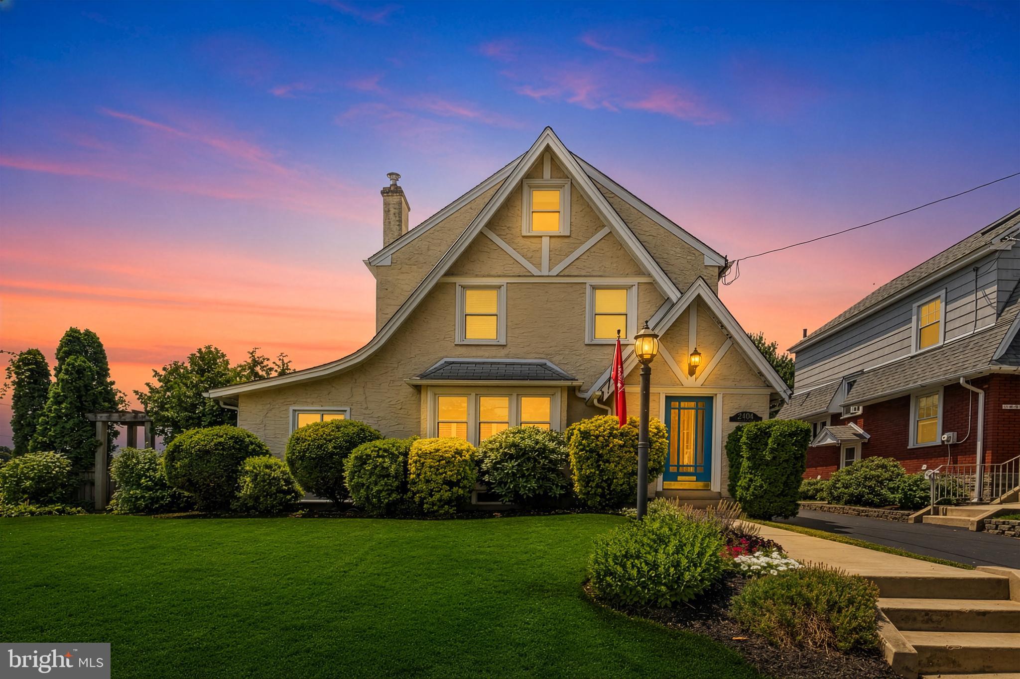 Situated on a leafy and manicured lot in Havertown’s prime Merwood Park neighborhood, 2404 Poplar Road is a classic Tudor home that charms with its timeless architecture, quality construction, and contemporary updates. Offering 3+ bedrooms, 2 full bathrooms, and multiple bonus spaces that can easily adapt to your lifestyle, this house has been designed to suit the homeowner's varied needs. A charming vestibule welcomes you inside, where the main level unfolds with an inviting open layout. The living room showcases beautifully preserved oak hardwood floors, a coffered ceiling, a gas fireplace, custom built-ins, and a sun-filled bay window. Just beyond, the spacious dining room features matching hardwood flooring, another bay window, and French doors that open directly to the backyard. The expanded kitchen has been tastefully redesigned with white shaker cabinetry, stainless steel appliances, a breakfast bar, and a gas cooktop—plus views overlooking the private, fenced backyard. Also on the first floor is a versatile bonus room currently used as a home office, equally suited as a den, playroom, or additional living space. The finished lower level provides even more flexibility; it makes for a great guest suite, recreation room, or home gym—and is complete with a tiled bathroom with a walk-in shower. The laundry and utility areas are neatly tucked behind closet doors lining the basement walls. Upstairs, the second floor houses two bedrooms and a full hallway bathroom. The sunny primary bedroom is made up of two original bedrooms that have been combined to create a generous bedroom with an impressive walk-in dressing room and closet tucked behind sliding barn doors. Should your needs change, the walk-in closet can easily be restored to an additional bedroom or even reconfigured to accommodate another full bathroom. A second bedroom, currently a nursery, and an elegant hall bath featuring timeless tile selections complete the level. The third floor adds even more possibilities with a spacious bedroom and an adjoining bonus room that could serve as a home office, walk-in closet, or future full bathroom. The property's layout easily supports a four-bedroom configuration while offering the potential to add additional bathrooms. Throughout the home, you'll find thoughtful custom details like specialty moldings, shiplap accents, coffered ceilings, and charming built-in nooks that add warmth and personality. Outdoor living is equally inviting, with a wooden deck accessed through the dining room's French doors, overlooking the beautifully landscaped backyard. Multiple entry points in and out of the home create exceptional functionality for everyday living and entertaining. Filled with natural light and overflowing with character, this remarkable Merwood Park residence offers the perfect combination of historic charm, modern comfort, and an unbeatable walkable location in the heart of Haverford Township. Enjoy the convenience of walking to neighborhood parks, the train, local shops, and restaurants, while also being just minutes from everything in Havertown and Ardmore! Disclaimer: Listing broker and licensees do not guarantee square footage or tax data. Certain photos have been virtually staged. We look forward to your visit!