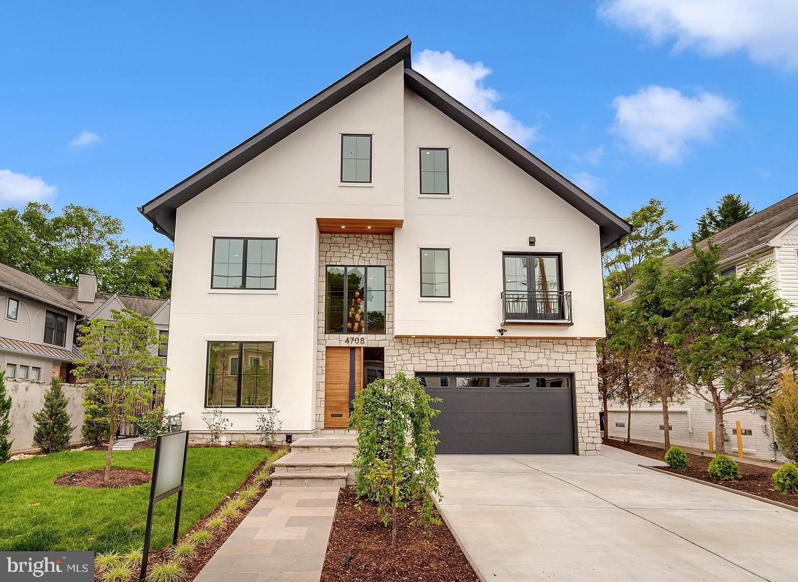 Set on a beautifully crafted homesite in the heart of Bethesda, this exceptional custom residence blends timeless architecture with elevated modern living. Wrapped in traditional stucco with striking stone veneer accents, the home makes an unforgettable first impression with its Indiana limestone front porch and steps, mahogany wood ceiling details, and refined architectural lines. Inside, thoughtfully designed spaces unfold across four finished levels, offering an ideal balance of elegance, comfort, and functionality.

The main level is anchored by a stunning chef’s kitchen featuring sleek Italian Bellure cabinetry, dramatic Dekton slab countertops, premium Sub-Zero and Wolf appliances including a 48-inch range and hood, Bosch dishwashers, and an oversized center island designed for gathering and entertaining. Expansive living and dining spaces are complemented by a dramatic family room with fireplace, custom millwork details, oversized Pella energy-efficient windows and doors, and seamless flow to the outdoor patio with natural gas hook up.

The upper level showcases a luxurious owner’s suite with a spa-inspired bath clad in Porcelanosa wall slabs, Kohler fixtures, generous walk-in closets, and sophisticated finishes throughout. Three additional bedrooms, each with full baths, and a convenient second-floor laundry room provide exceptional livability and flexibility. Hardwood flooring, oversized windows, and carefully curated architectural detailing continue throughout the level.

The top-level retreat functions beautifully as a private guest apartment with private access staircase, complete with its own kitchen, living area, bedrooms, baths, laundry, and balcony, creating rare versatility for multigenerational living or extended guests.

The finished lower level offers impressive additional living space with a large recreation room, guest bedroom, full bath, home office, bar area, and abundant storage. 

Built with both luxury and performance in mind, the home includes Carrier high-efficiency HVAC systems with three separate zones, a high-efficiency gas water heater, spray foam insulation for enhanced energy efficiency and sound attenuation, smart home integration with Cat5 wiring on every floor, and premium plumbing and lighting selections throughout.

Ideally located just moments from downtown Bethesda, NIH and Naval Hospital, I-495, and I-270, this extraordinary residence offers sophisticated new construction, thoughtful design, and exceptional luxurious Urban living in one of Bethesda’s most desirable neighborhoods.