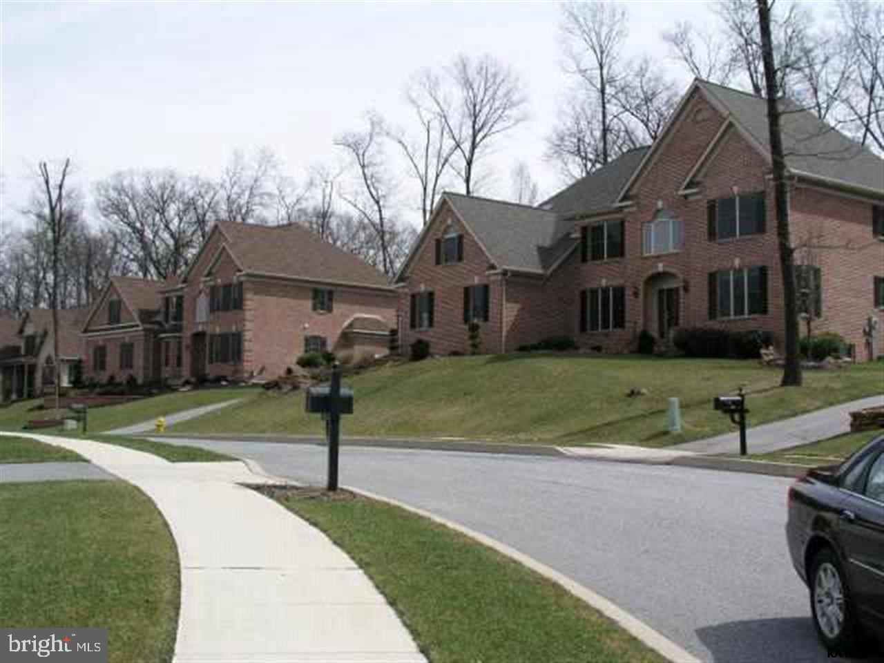 Taxes are estimated-Fantastic wooded lot with all public utilities. Custom built homes built exclusively by Jeffrey L. Henry. Many plans to choose from or bring your own. Call LA for plot and price sheet of other lots available.